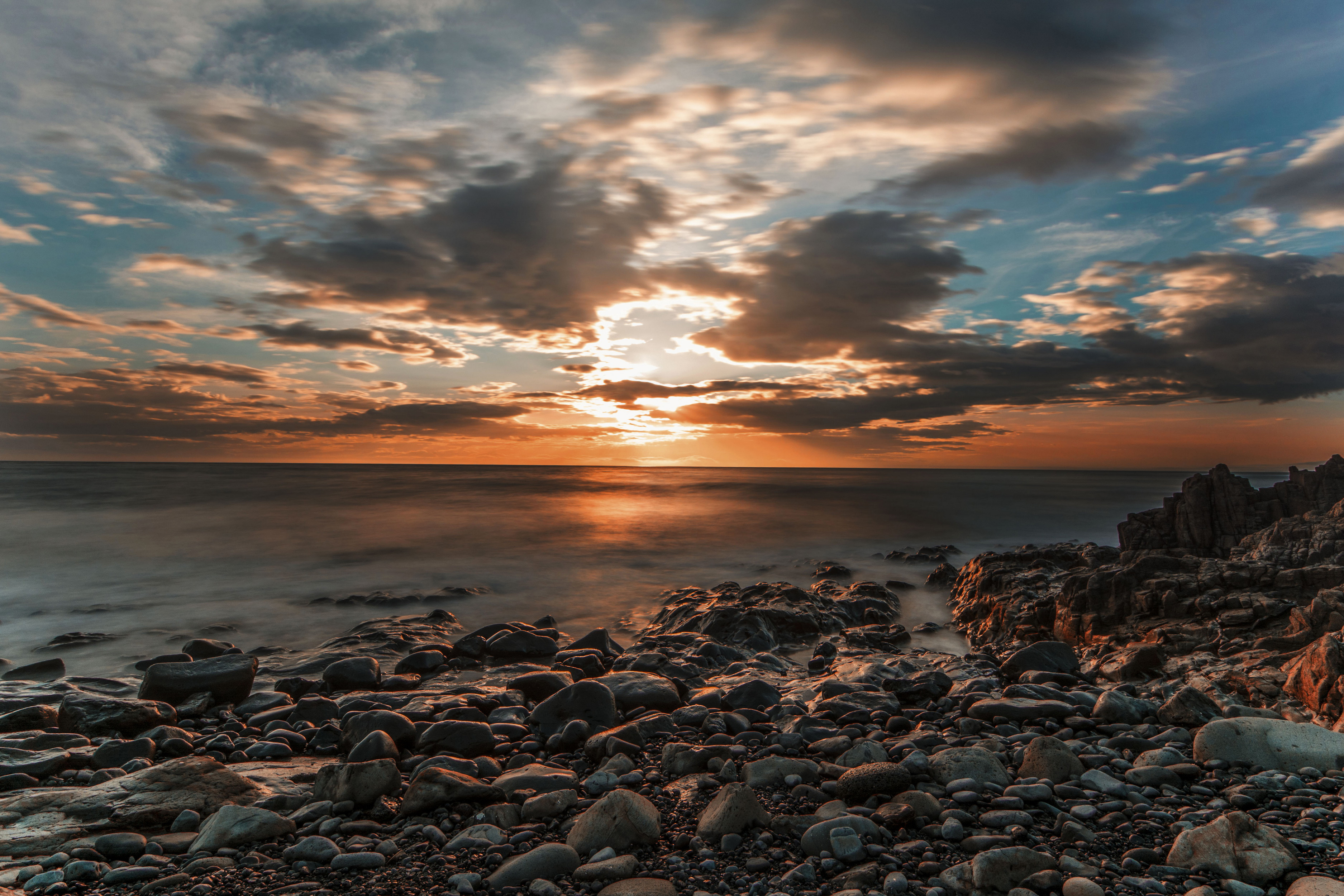 Download mobile wallpaper Nature, Sunset, Sky, Horizon, Ocean, Earth, Stone, Cloud for free.