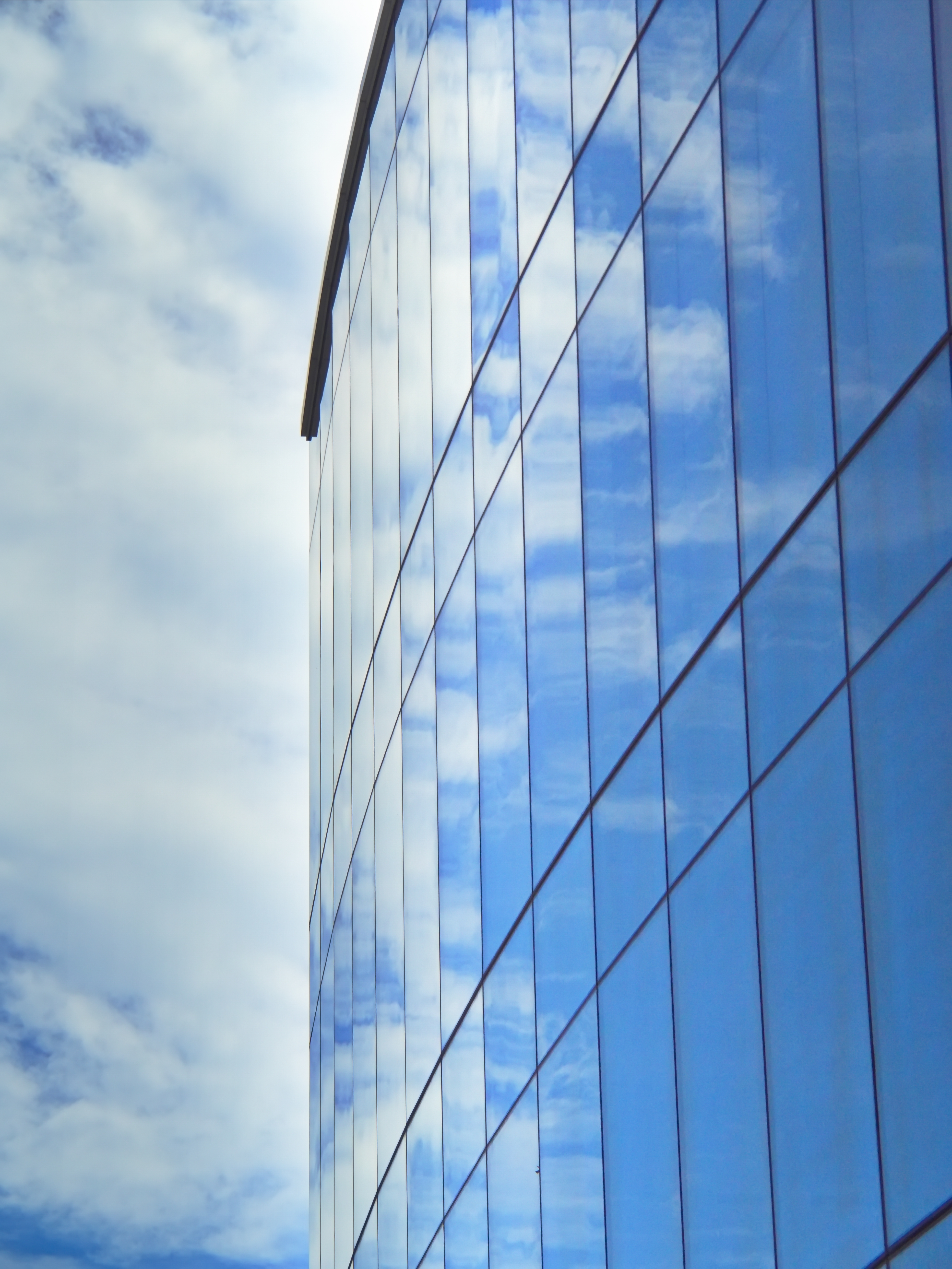 Download mobile wallpaper Clouds, Building, Facade, Miscellaneous, Miscellanea, Glass for free.