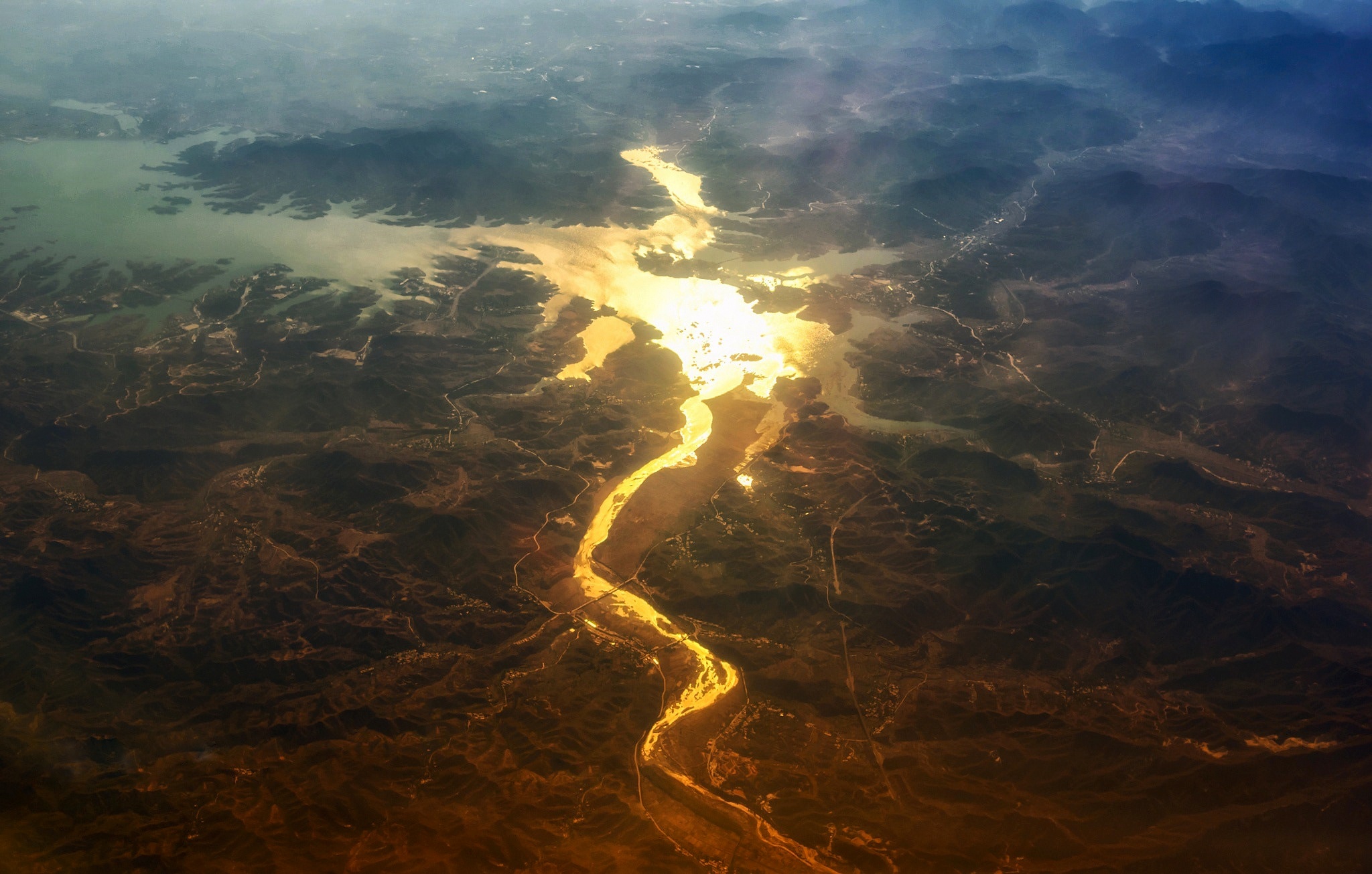 Download mobile wallpaper Landscape, Earth, Glow, River, Aerial for free.
