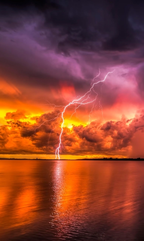 Download mobile wallpaper Sunset, Sky, Lightning, Earth, Storm, Cloud, Photography for free.