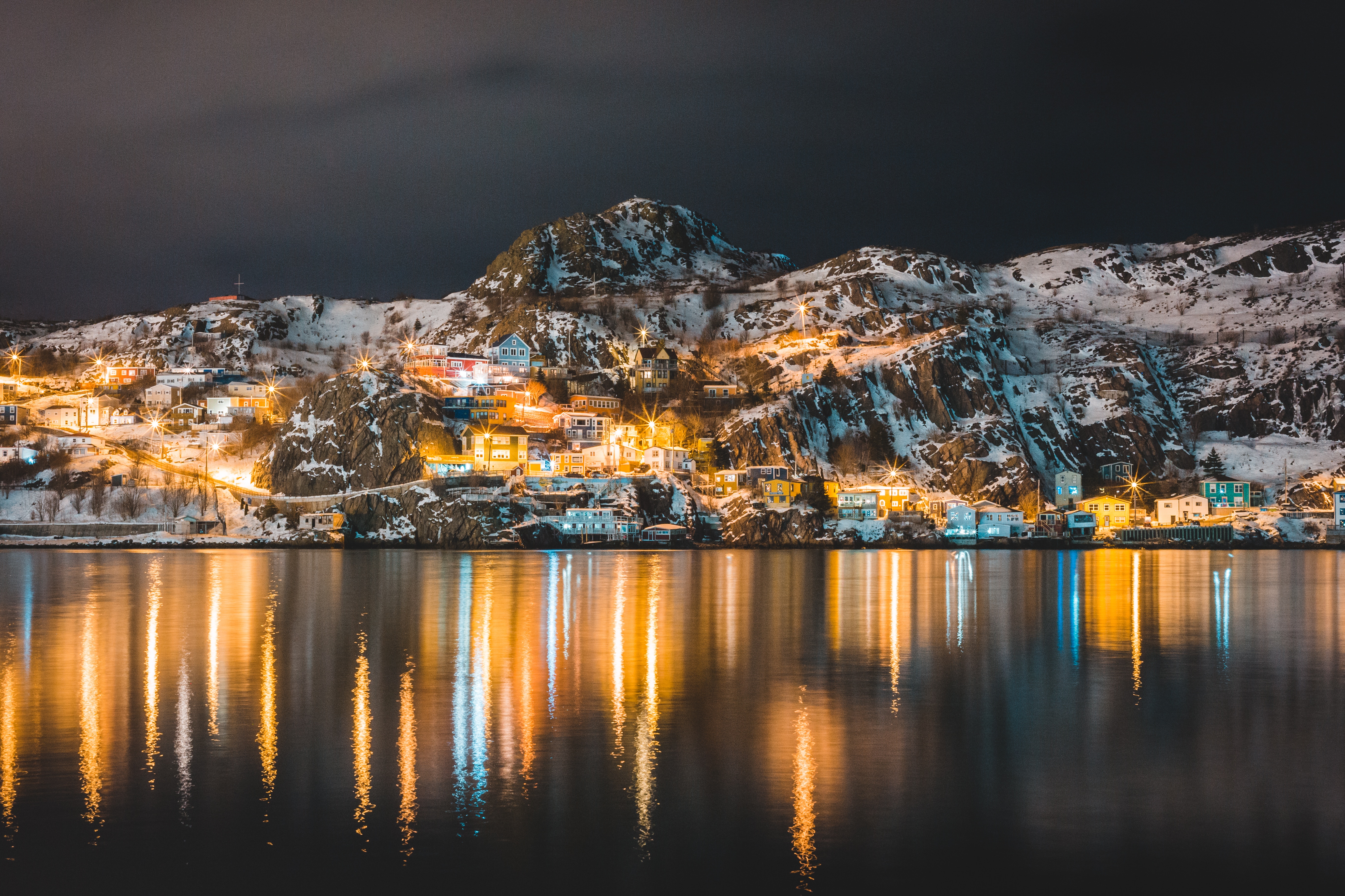 Download mobile wallpaper Village, Snow Covered, Lake, Snowbound, Mountains, Nature, Shine, Light, Night for free.