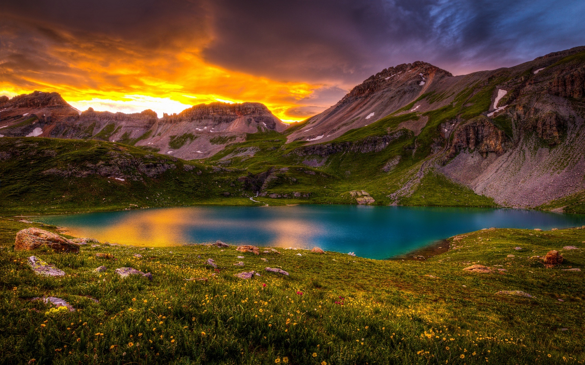 Free download wallpaper Sunset, Sky, Lakes, Mountain, Lake, Flower, Earth, Field, Cloud, Orange (Color) on your PC desktop
