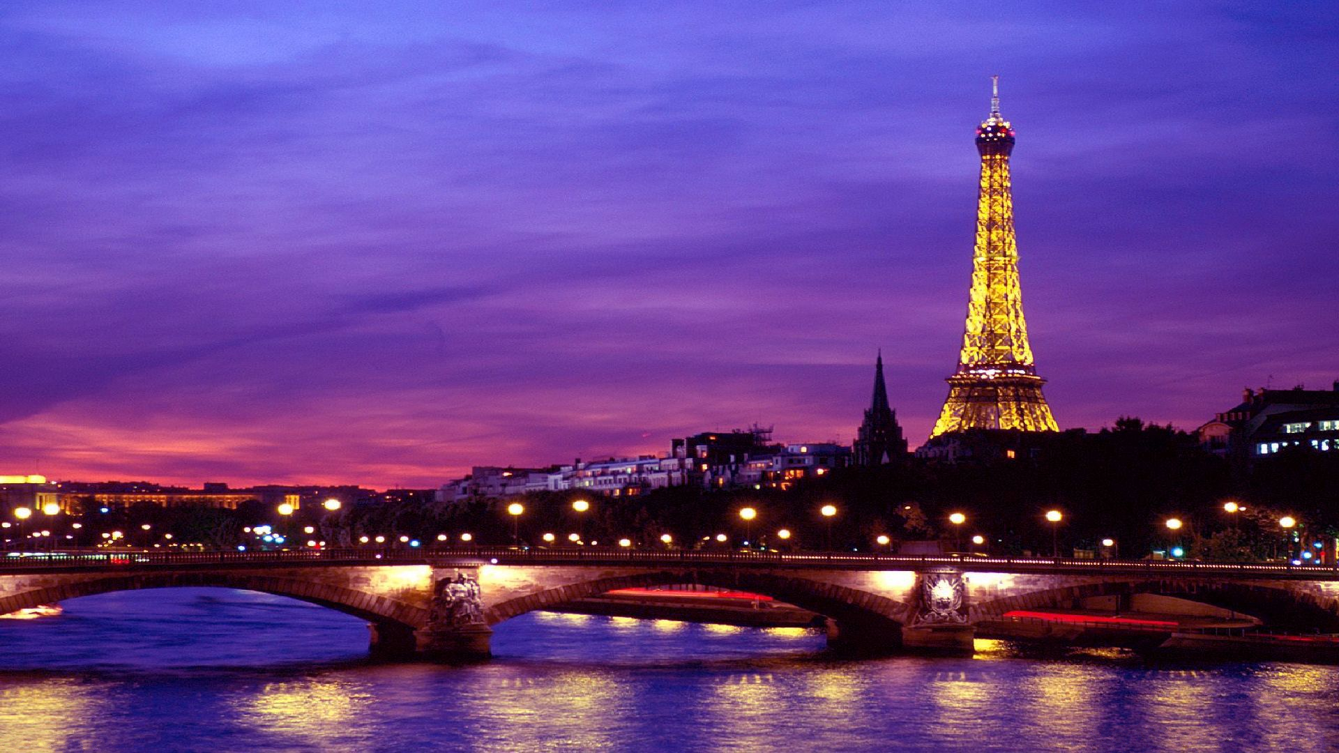Скачать картинку Париж, Эйфелева Башня, Памятники, Свет, Франция, Мост, Сделано Человеком, Сена в телефон бесплатно.
