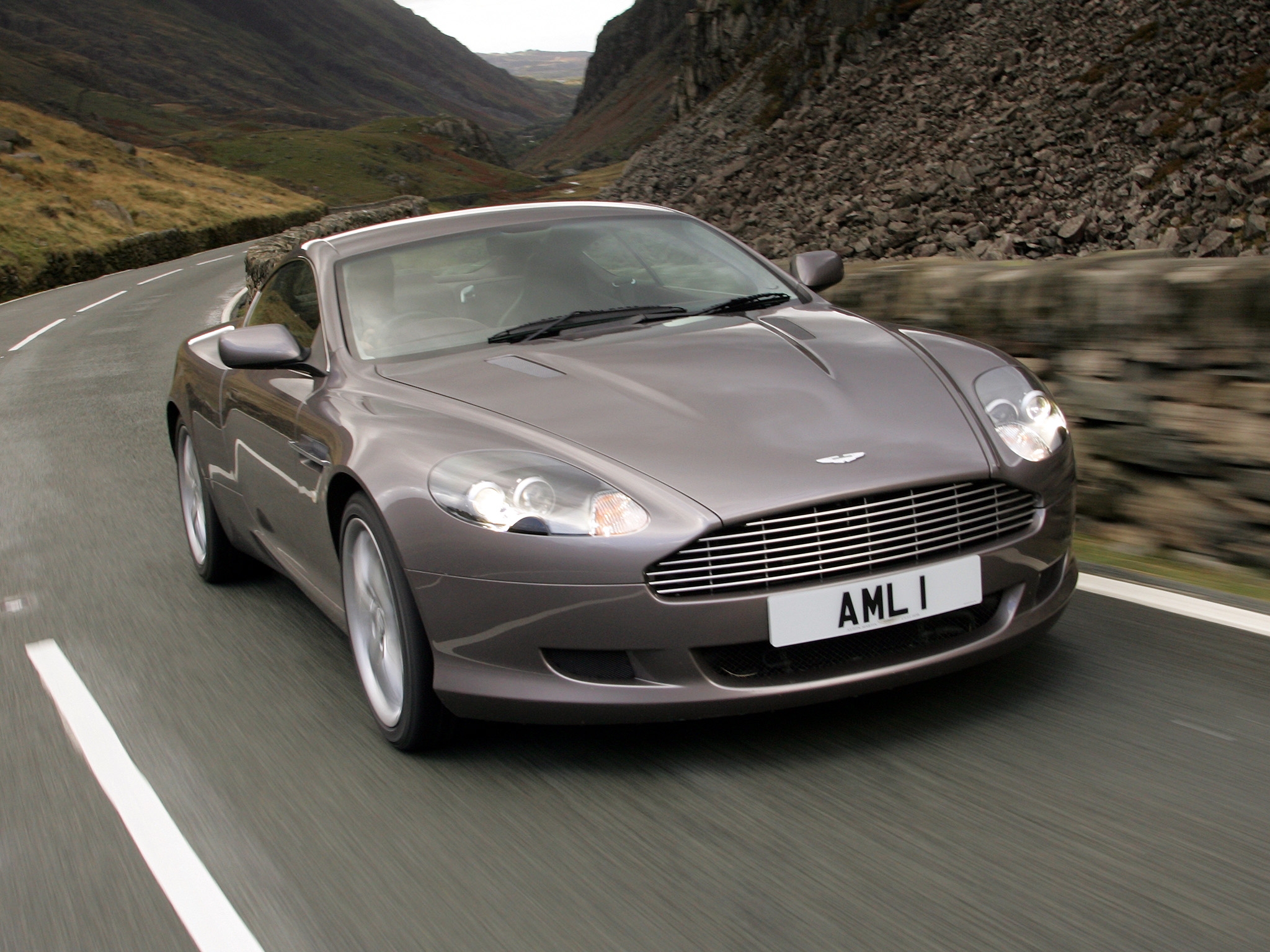 Windows Backgrounds auto, mountains, aston martin, cars, asphalt, front view, grey, speed, style, 2004, db9