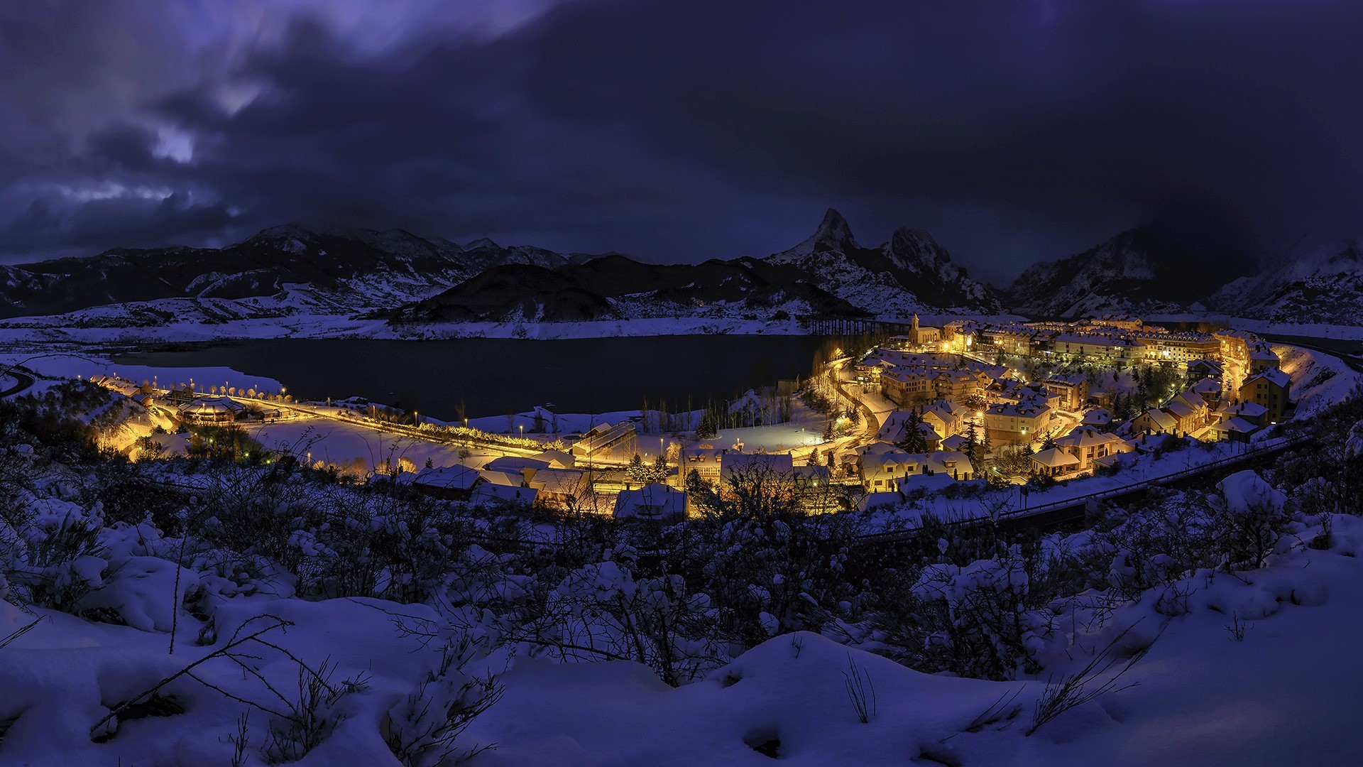 Download mobile wallpaper Winter, Night, Snow, Mountain, Lake, Light, Town, Man Made, Towns for free.