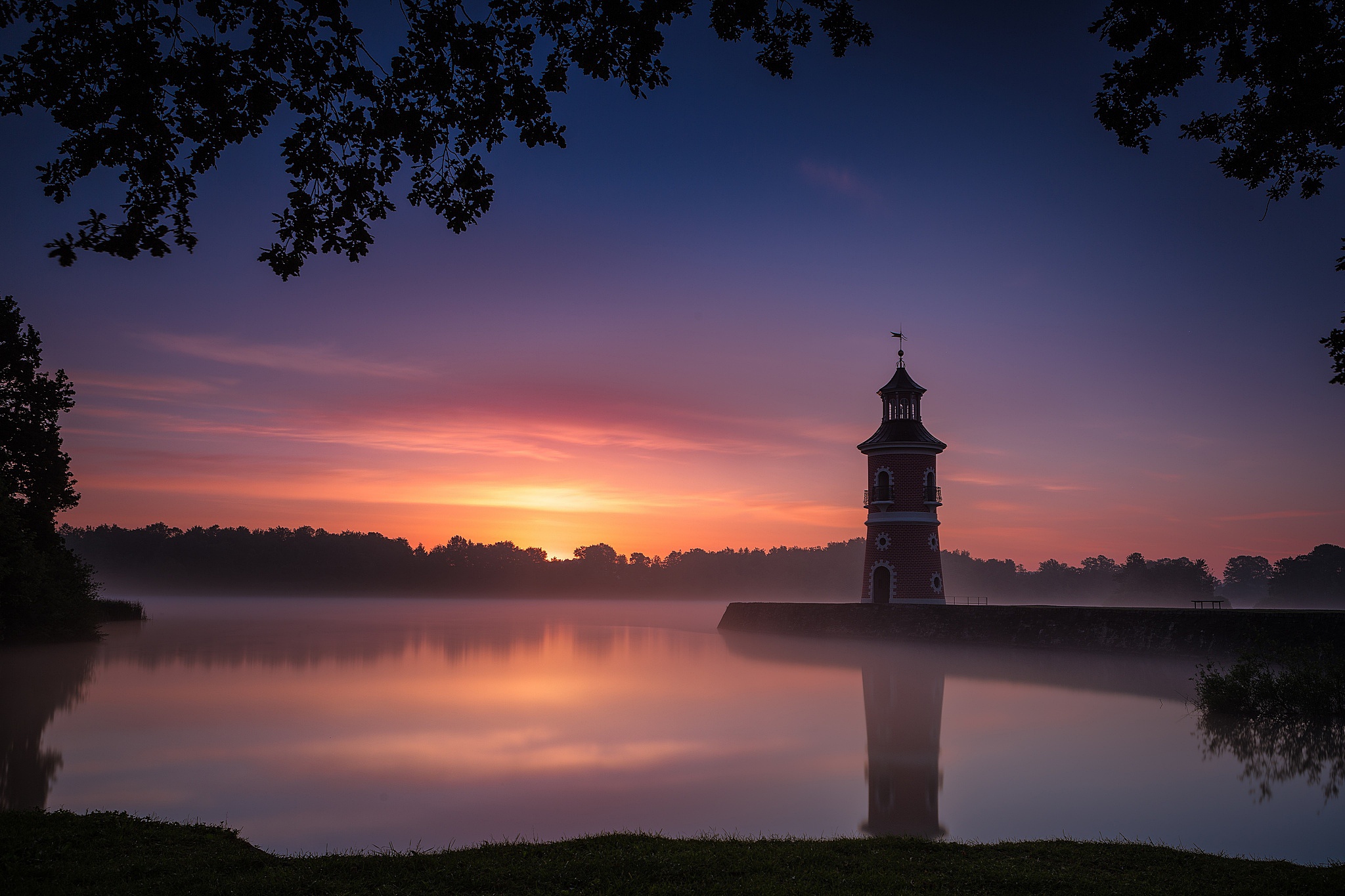 Free download wallpaper Sunset, Building, Reflection, Lighthouse, Man Made on your PC desktop