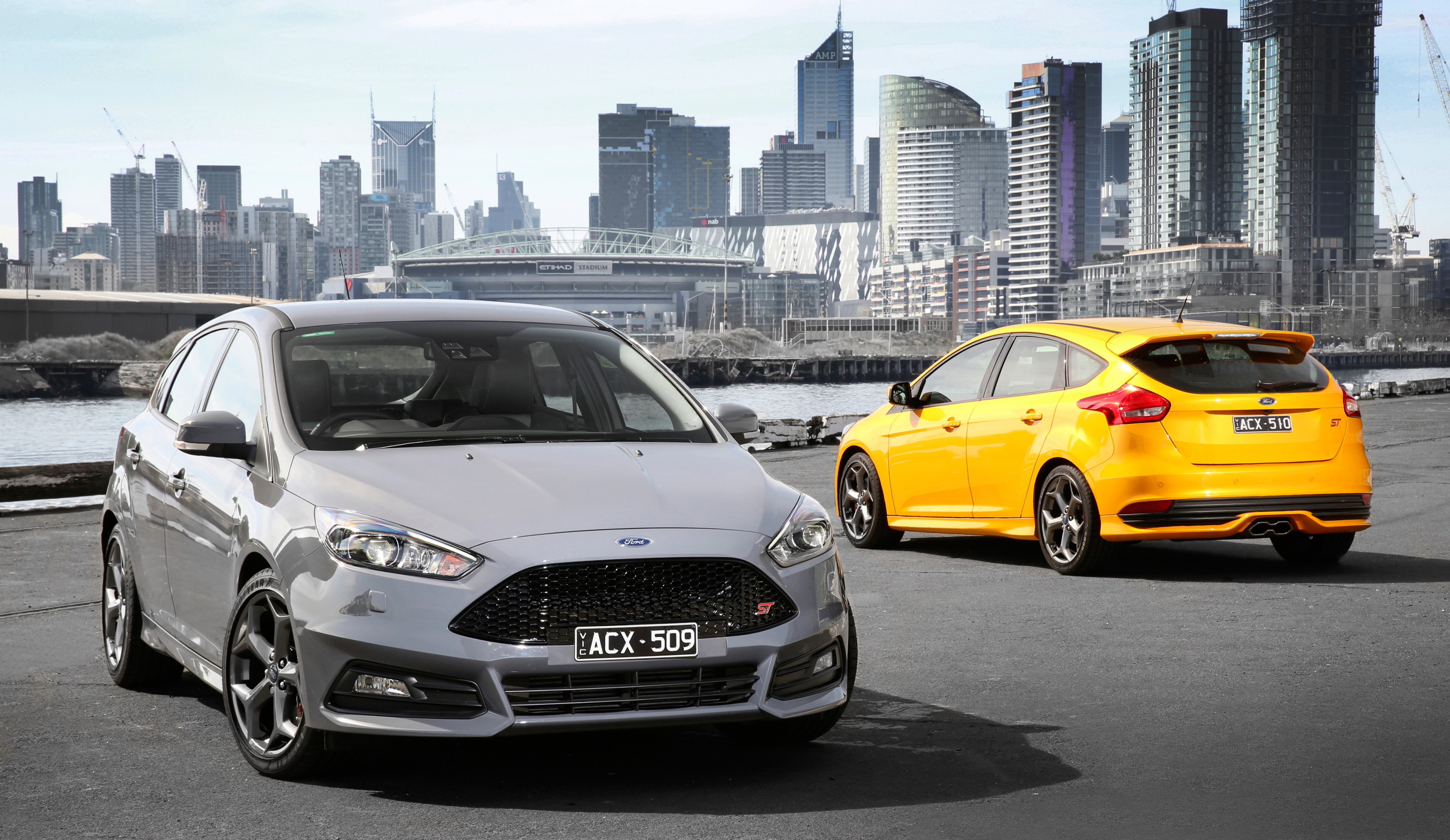 Download mobile wallpaper Ford, Car, Australia, Melbourne, Ford Focus, Compact Car, Vehicles, Silver Car, Yellow Car for free.