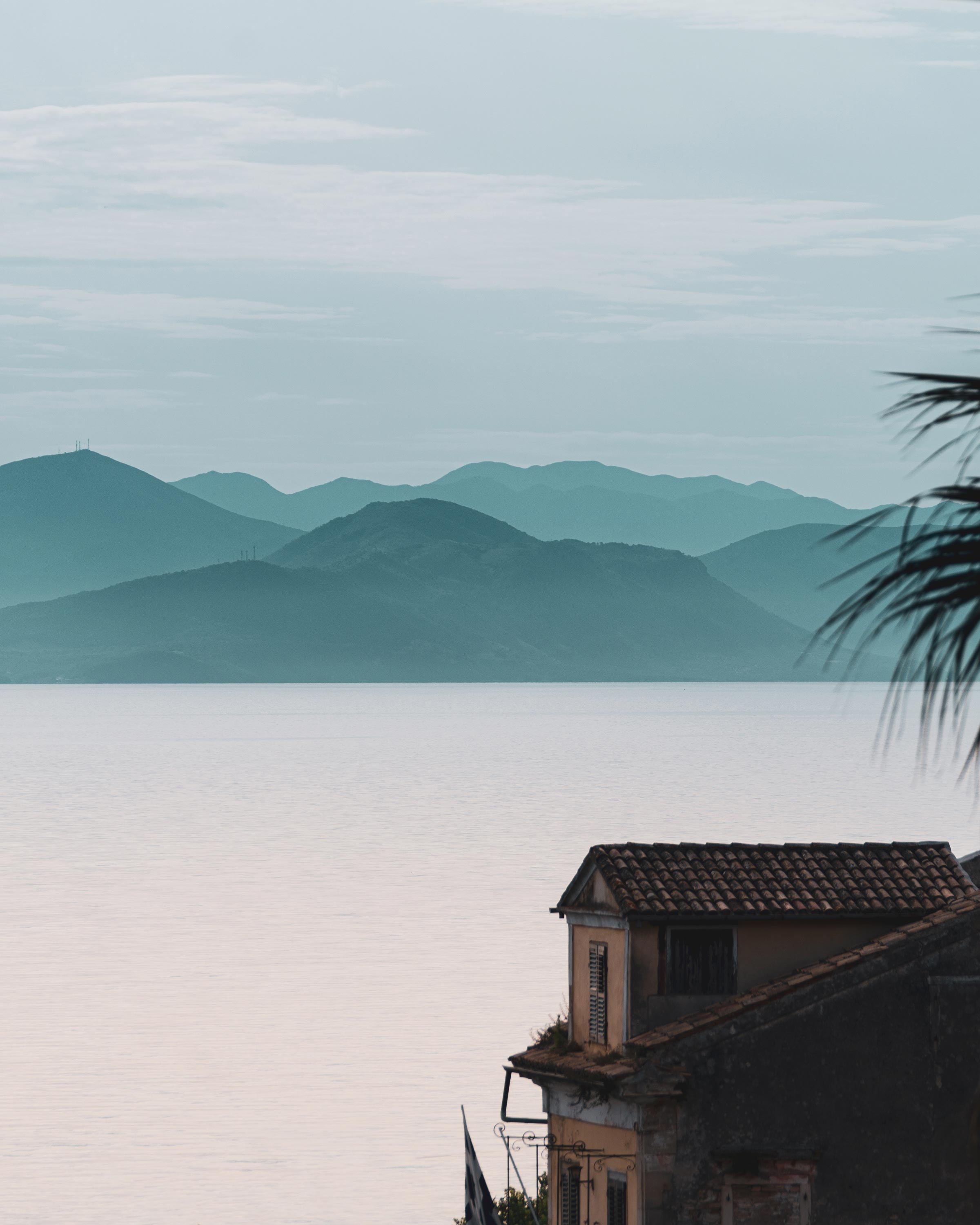 Free download wallpaper Nature, Building, Shore, Bank, Mountains, Sea, Fog, House on your PC desktop