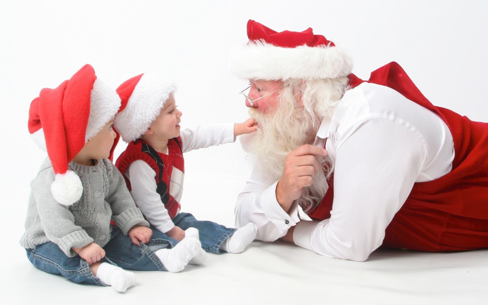 Скачать картинку Рождество, Младенец, Праздничные, Шляпа Санты, Санта в телефон бесплатно.