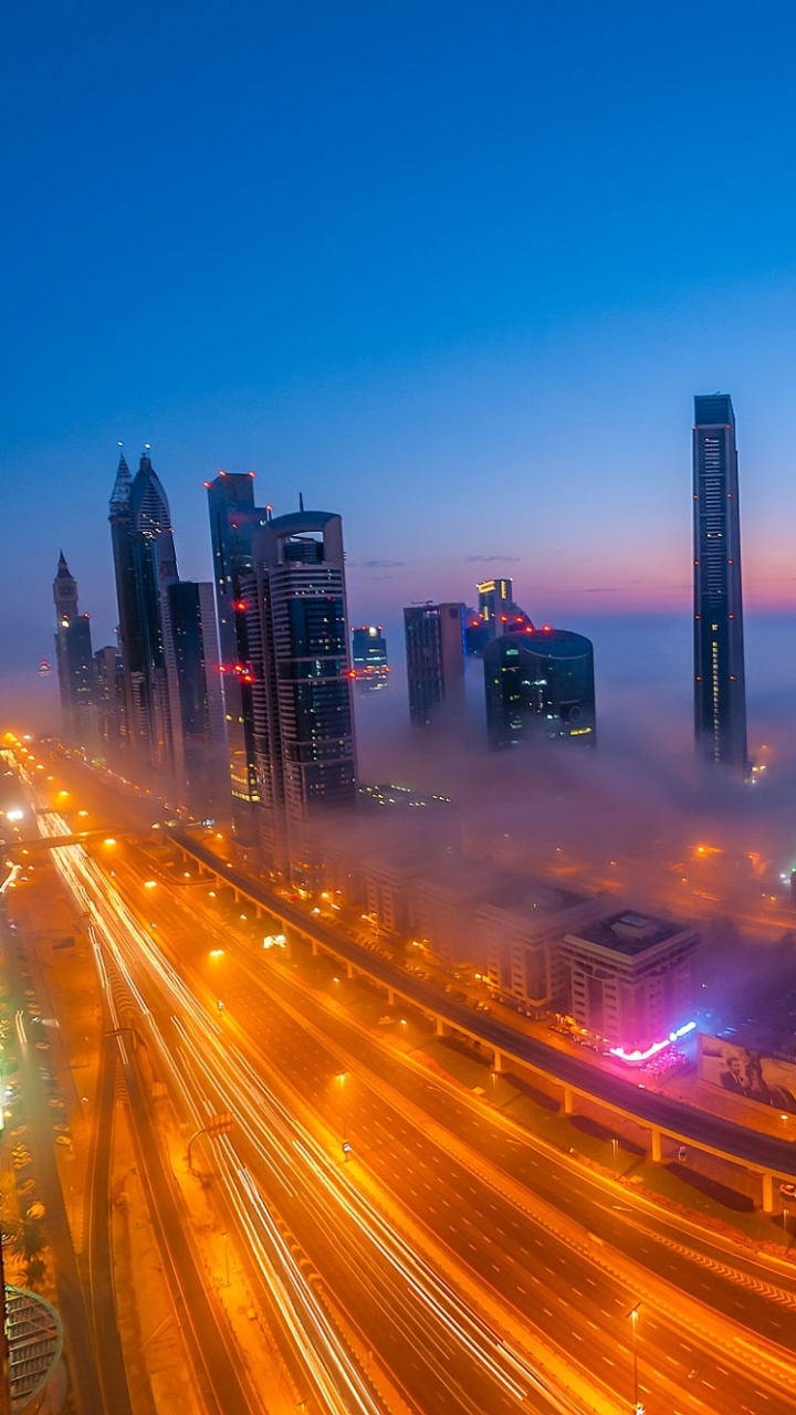 Handy-Wallpaper Städte, Stadt, Nebel, Dubai, Nacht, Menschengemacht, Großstadt, Zeitraffer kostenlos herunterladen.