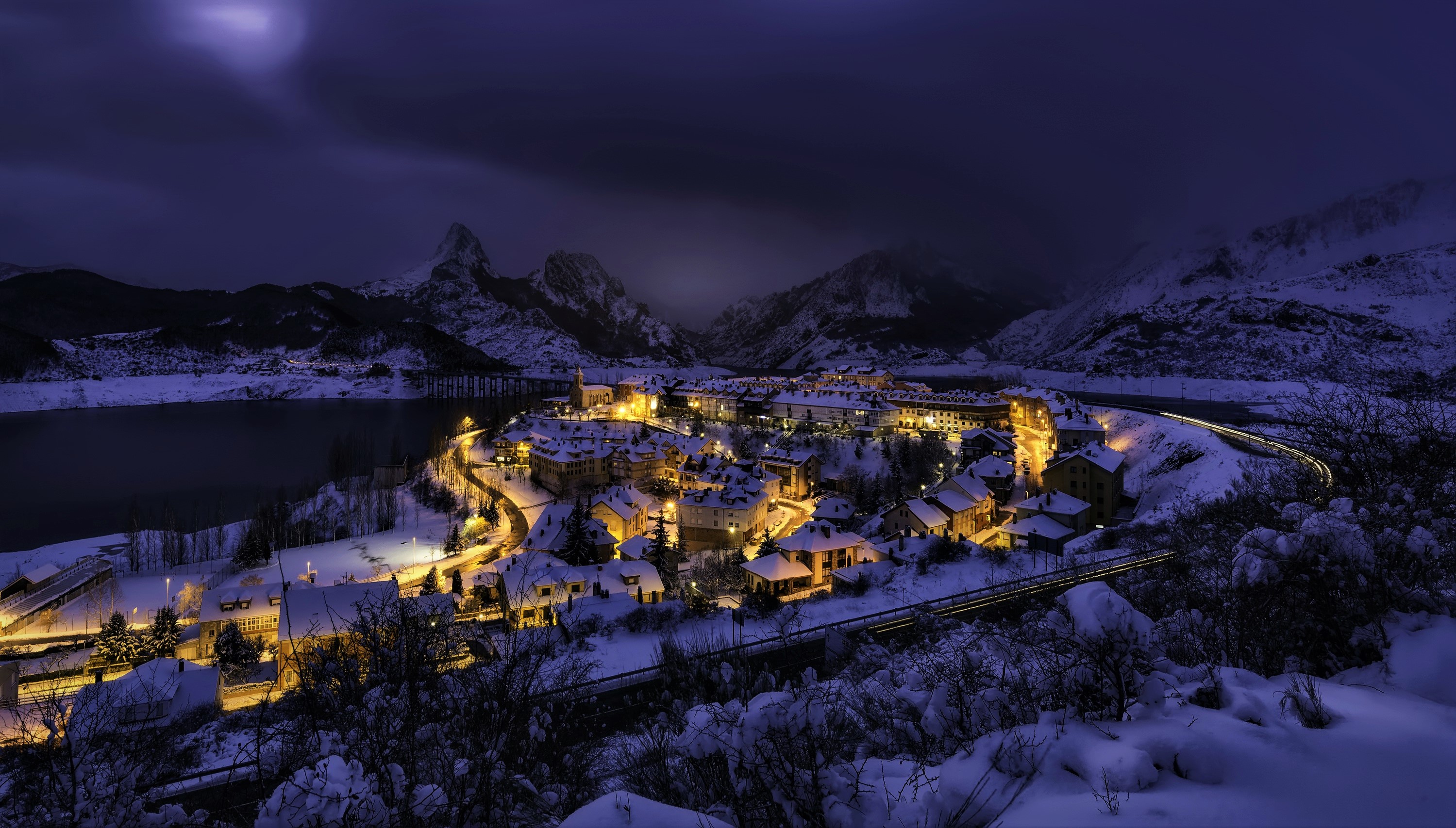 Download mobile wallpaper Winter, Snow, City, Mountain, Light, Photography, Town for free.