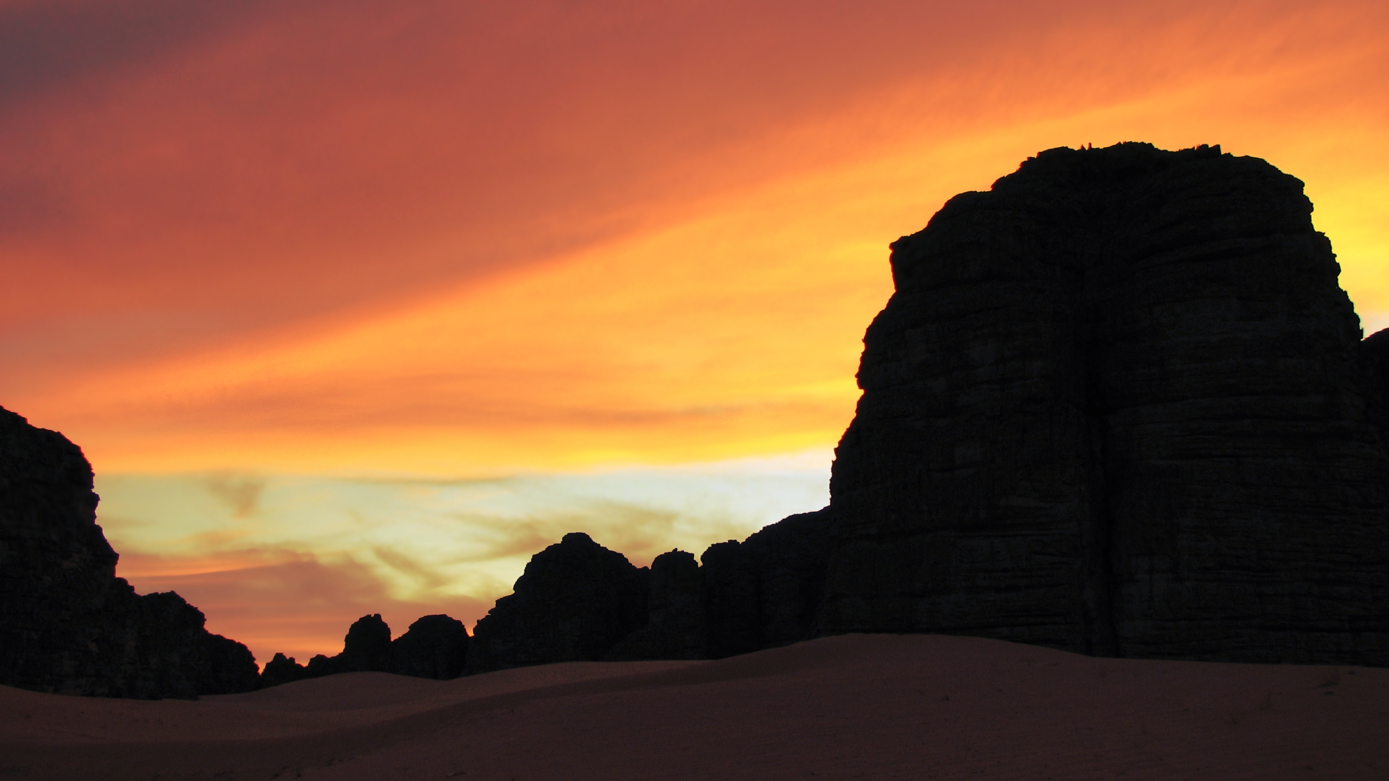 Download mobile wallpaper Sunset, Sand, Desert, Earth, Cloud, Sahara, Africa, Algeria, Tassili N'ajjer, Hoggar Mountains for free.