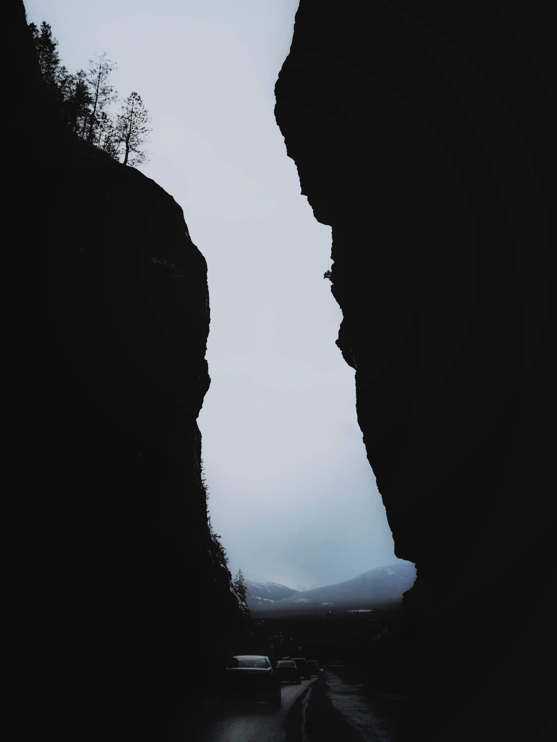 darkness, dark, mountains, night, cars, rocks, fog wallpaper for mobile