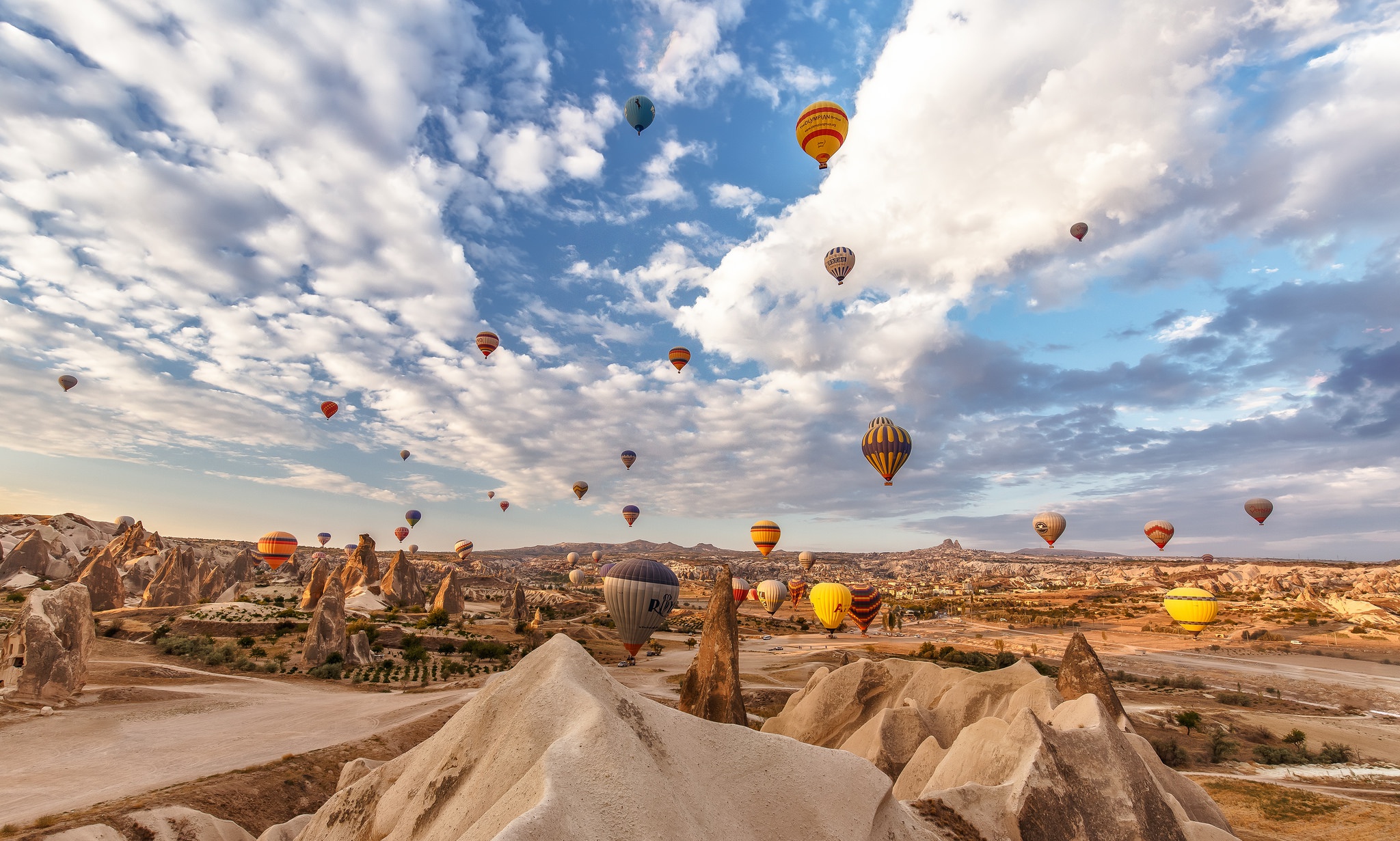 Download mobile wallpaper Landscape, Sky, Desert, Horizon, Cloud, Turkey, Vehicles, Hot Air Balloon for free.