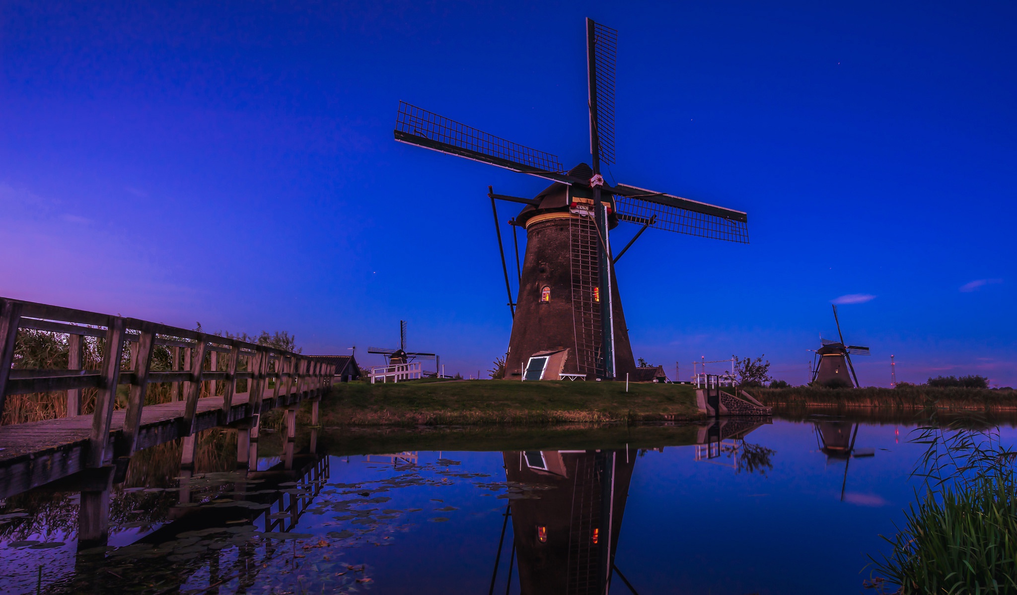 Free download wallpaper Reflection, River, Netherlands, Windmill, Man Made on your PC desktop