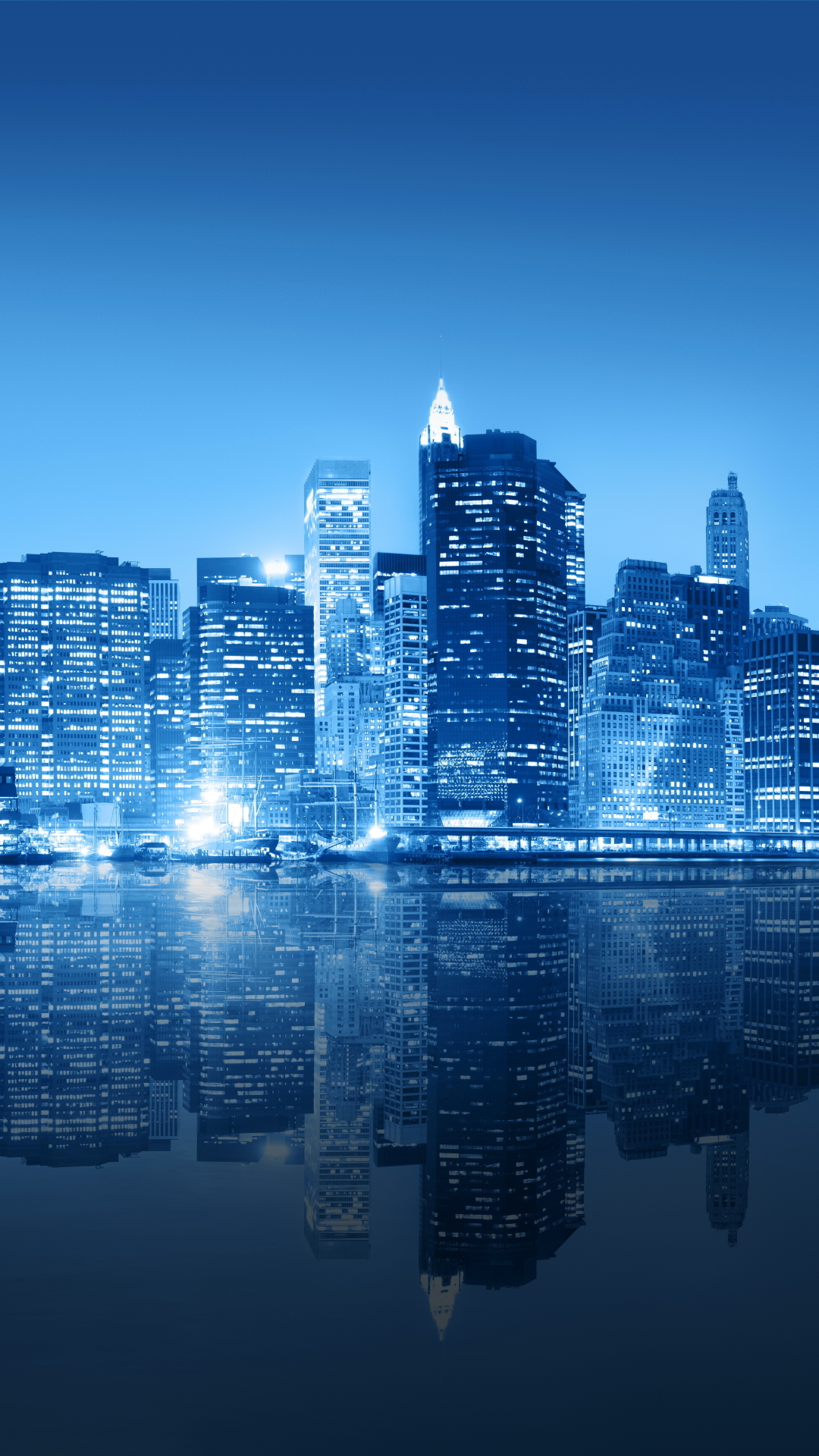 Download mobile wallpaper Cities, Night, City, Skyscraper, Building, Reflection, New York, Man Made for free.