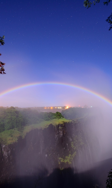 Download mobile wallpaper Stars, Rainbow, Waterfall, Fog, Starry Sky, Earth for free.