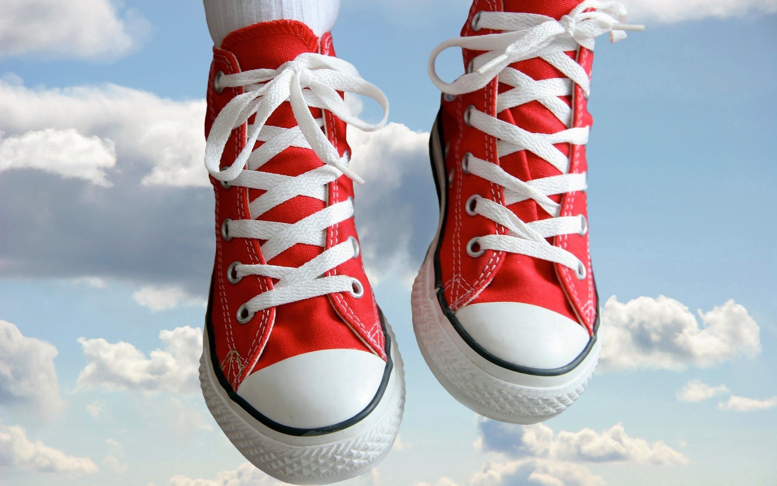 Download mobile wallpaper Clouds, Legs, Sky, Miscellaneous, Miscellanea, Sneakers, Shoes for free.