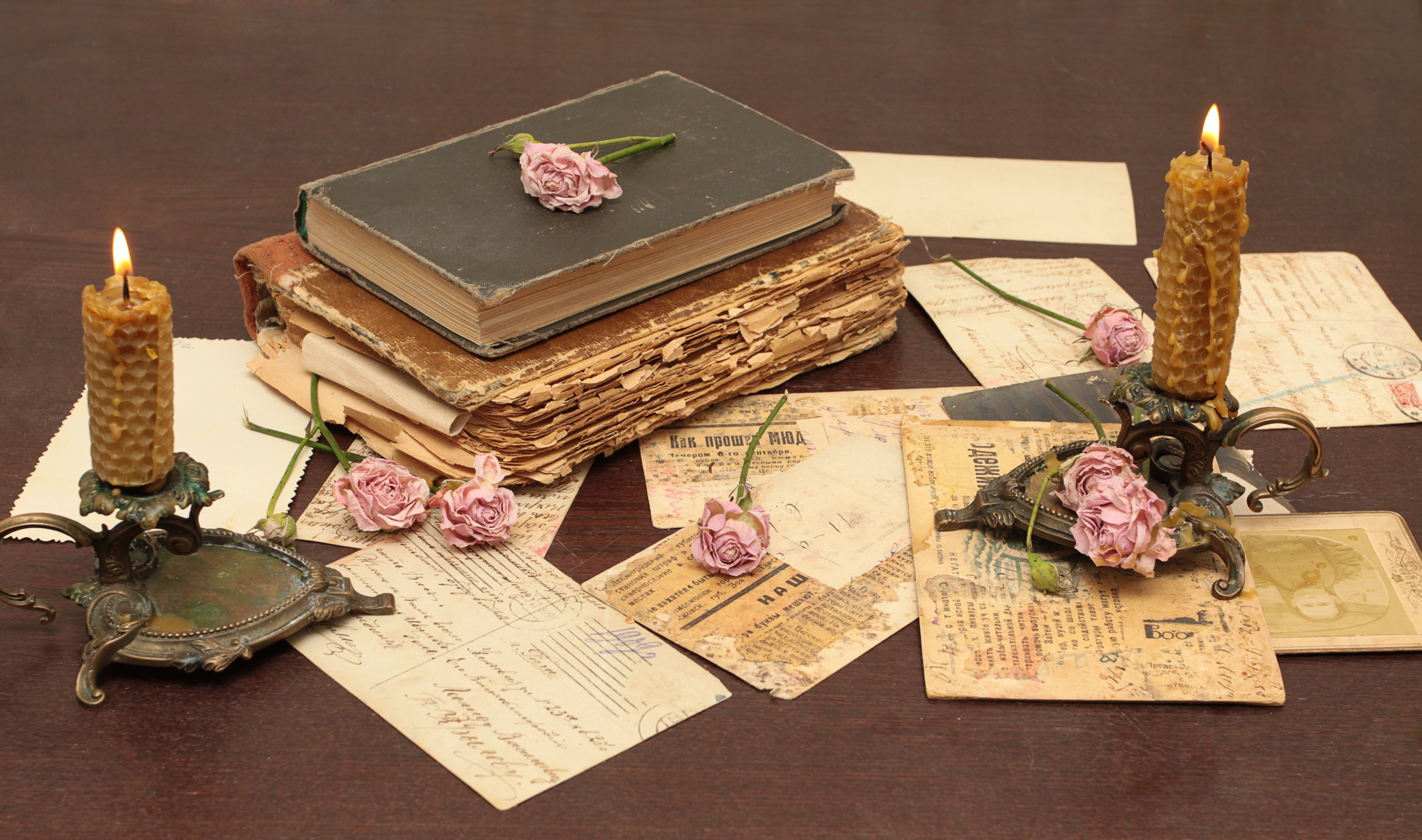 old, vintage, books, letters, candles, miscellaneous, miscellanea, flowers, roses, postcards, table, paper, candlesticks