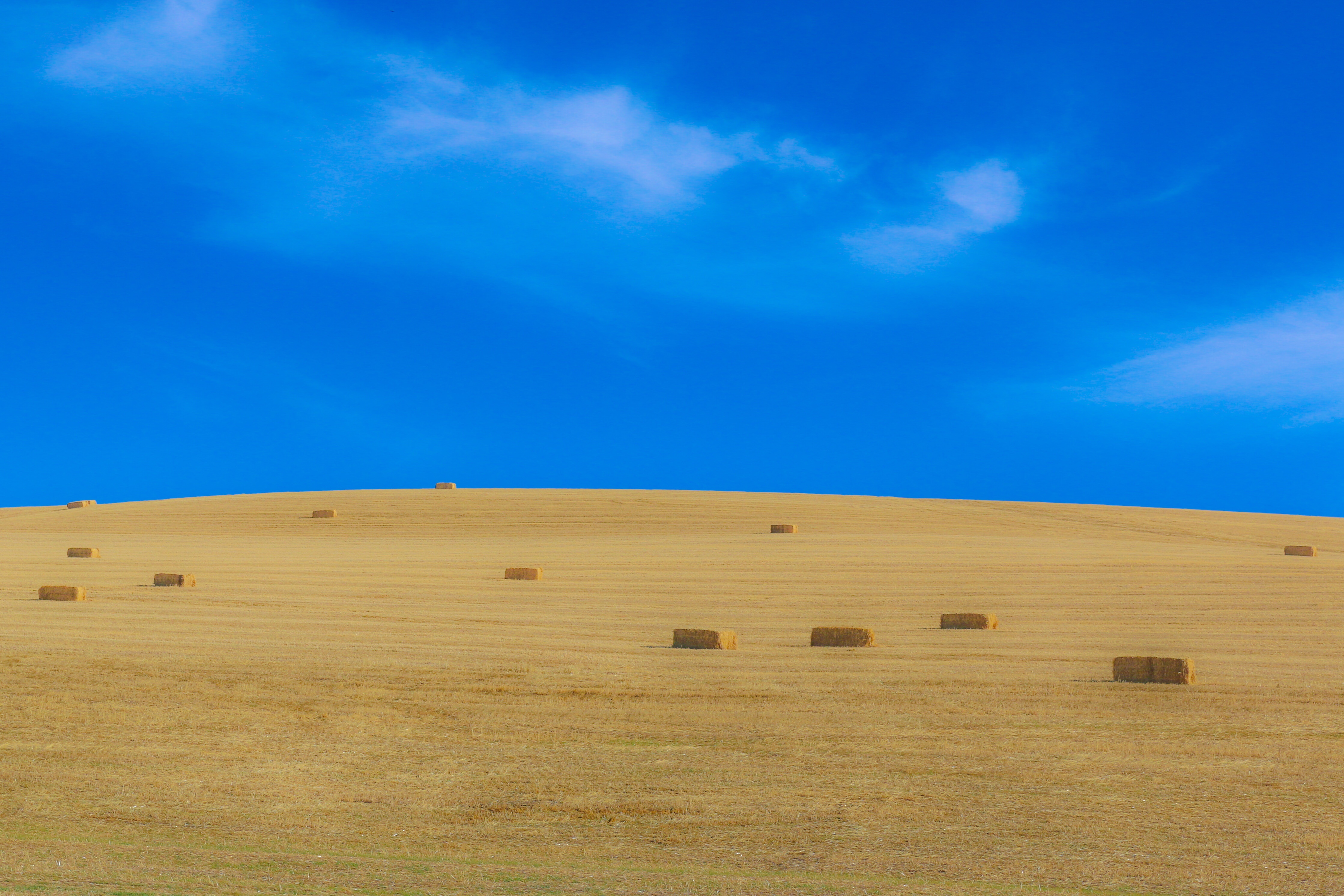 Download mobile wallpaper Nature, Sky, Summer, Earth, Field, Hill, Haystack for free.