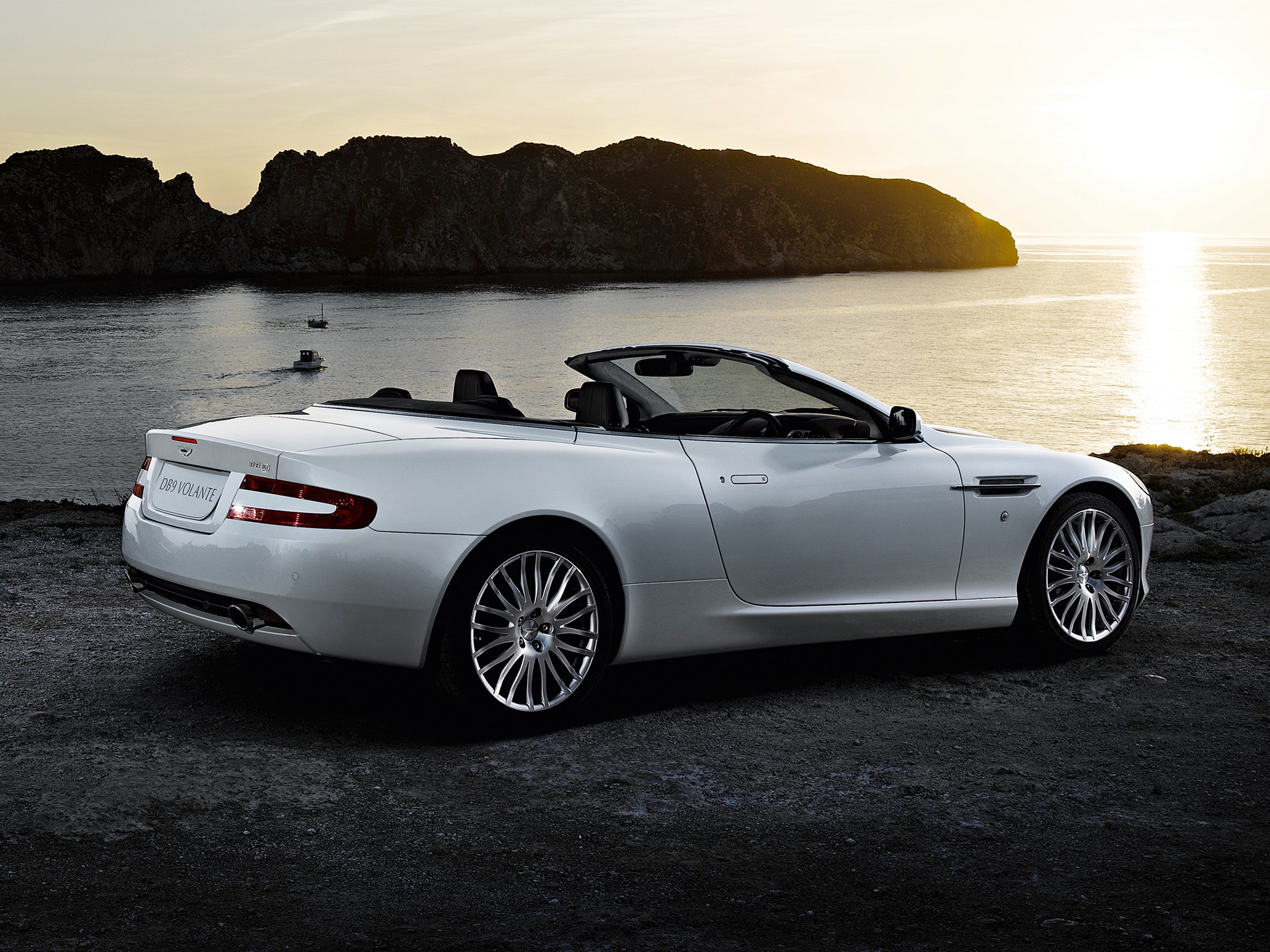 Download mobile wallpaper 2008, Db9, Rocks, Side View, Nature, Style, Aston Martin, Sea, Sunset, Cars, Auto for free.