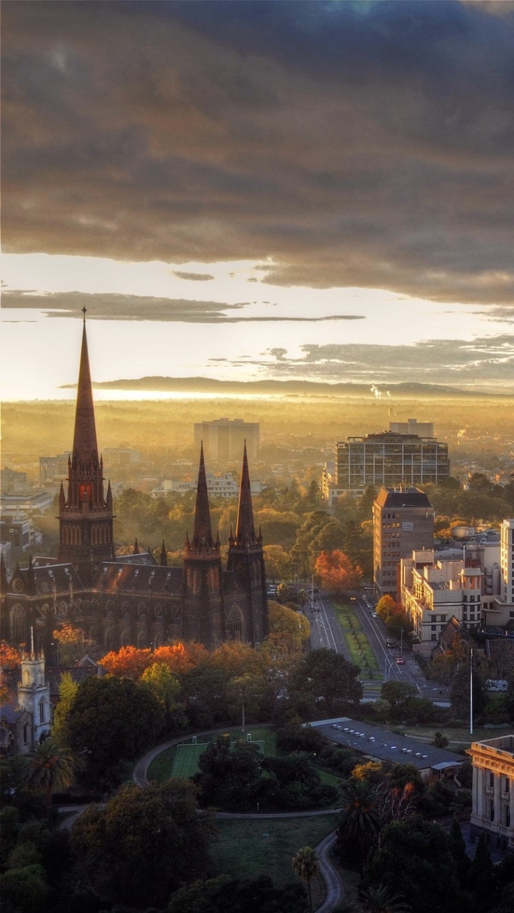 Скачать картинку Города, Церковь, Австралия, Мельбурн, Сделано Человеком, Солнечный Лучик в телефон бесплатно.