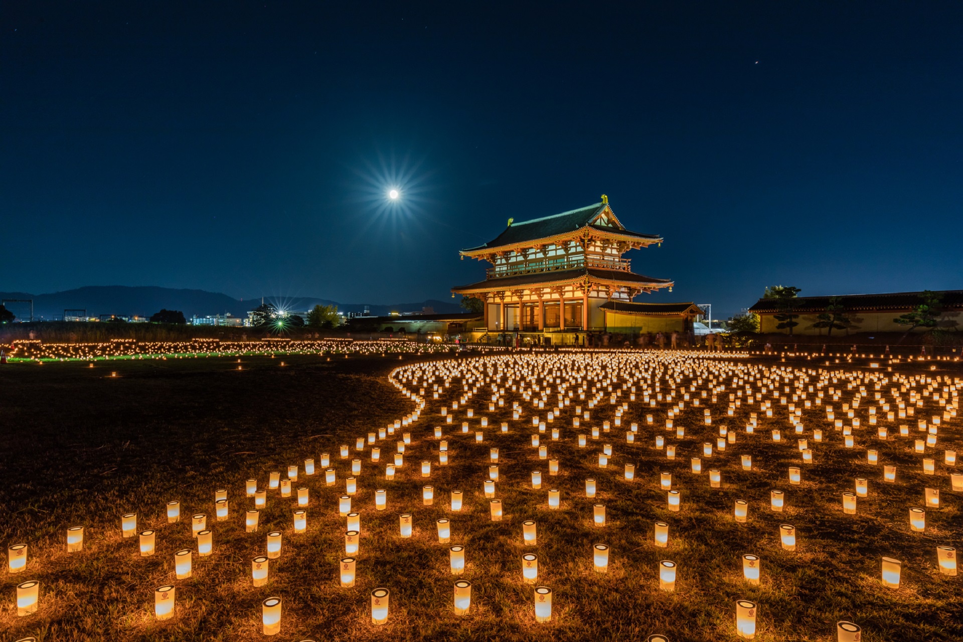 Download mobile wallpaper Night, Building, Candle, Oriental, Man Made for free.