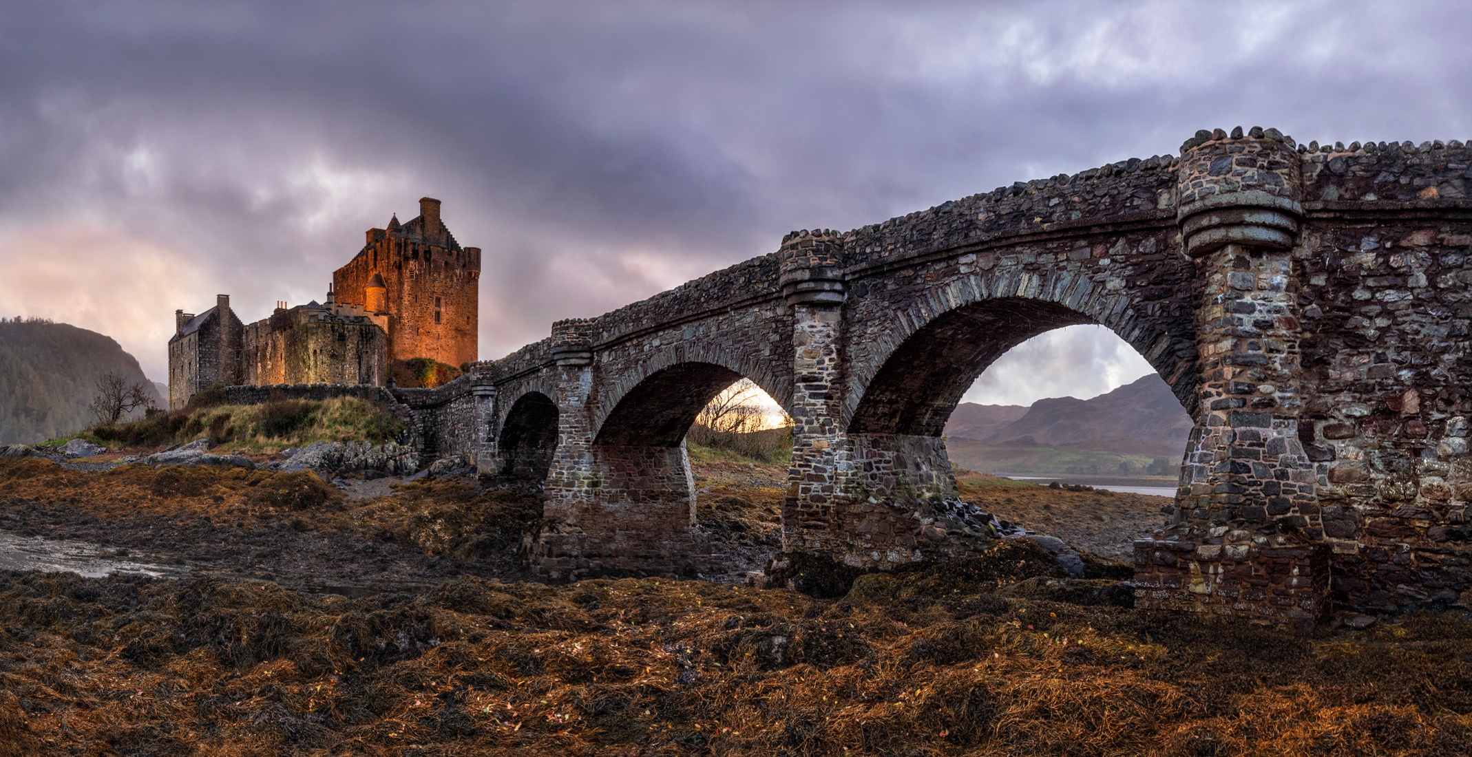 Скачать картинку Замки, Замок, Мост, Шотландия, Сделано Человеком, Замок Эйлен Донан в телефон бесплатно.