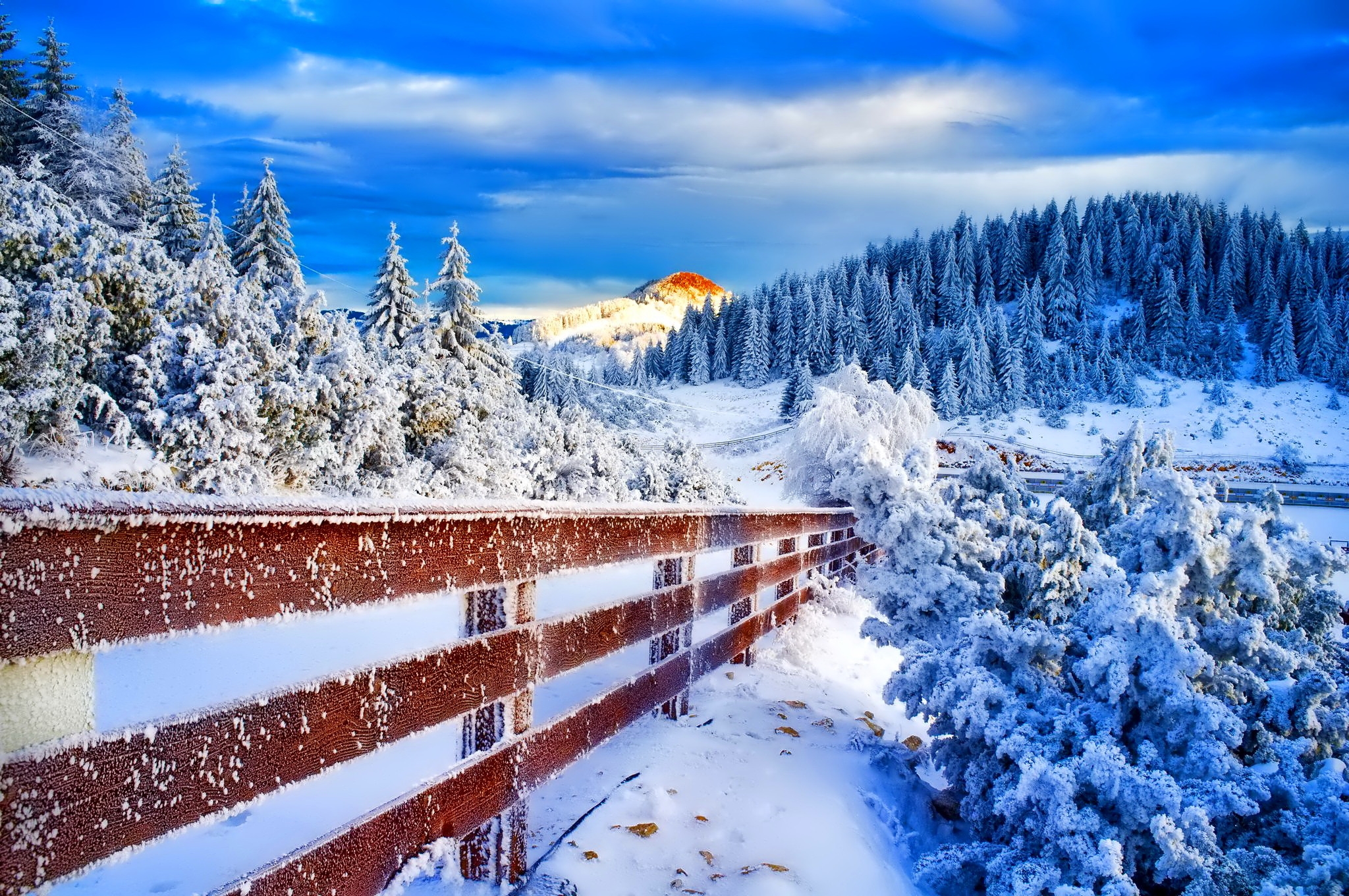 Download mobile wallpaper Winter, Snow, Mountain, Forest, Tree, Fence, Man Made for free.