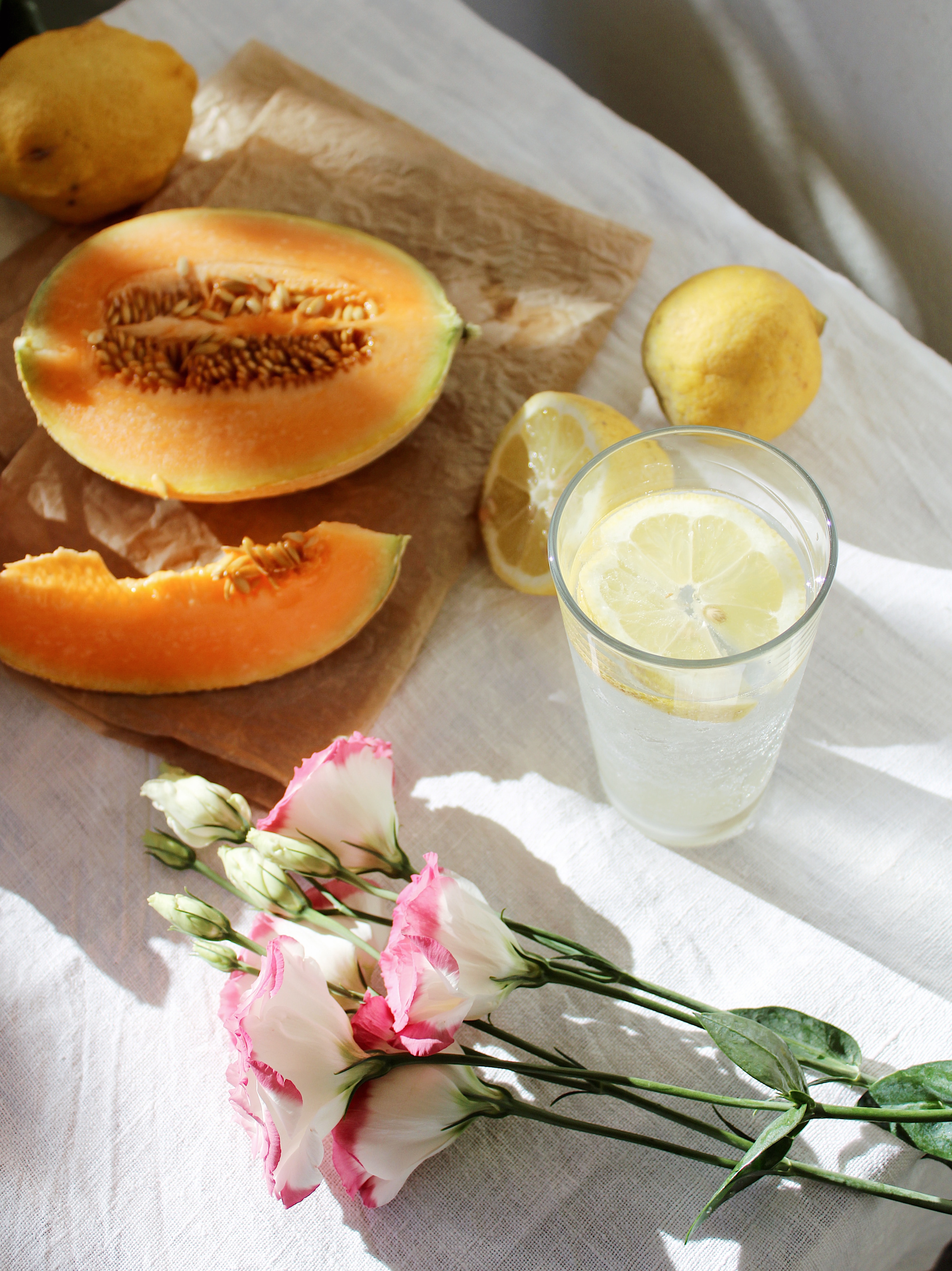 Download mobile wallpaper Lemonade, Melon, Flowers, Food, Lemon, Glass for free.