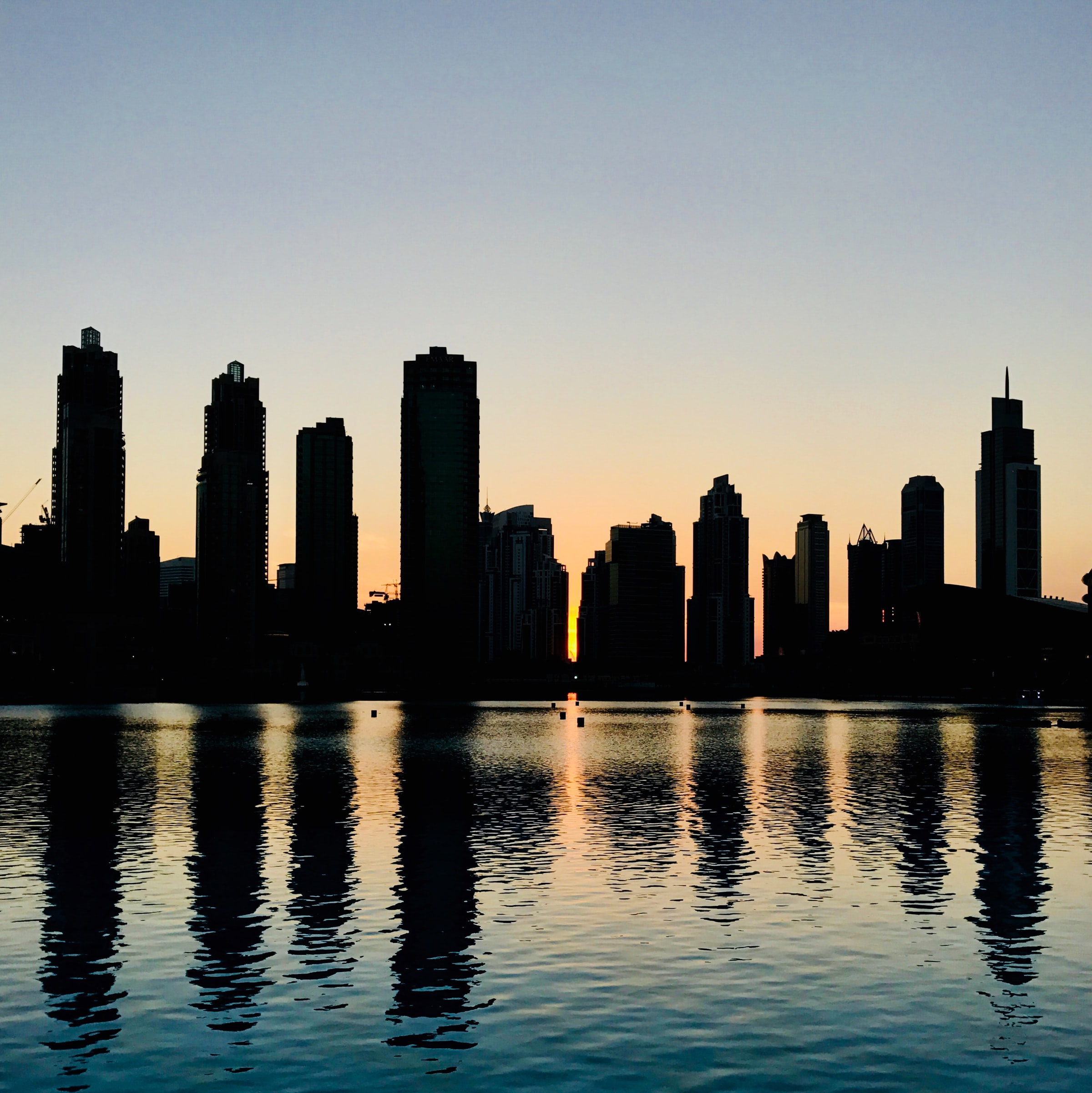 Free download wallpaper Cities, Water, Building, City, Glare, Skyscrapers, Silhouette on your PC desktop
