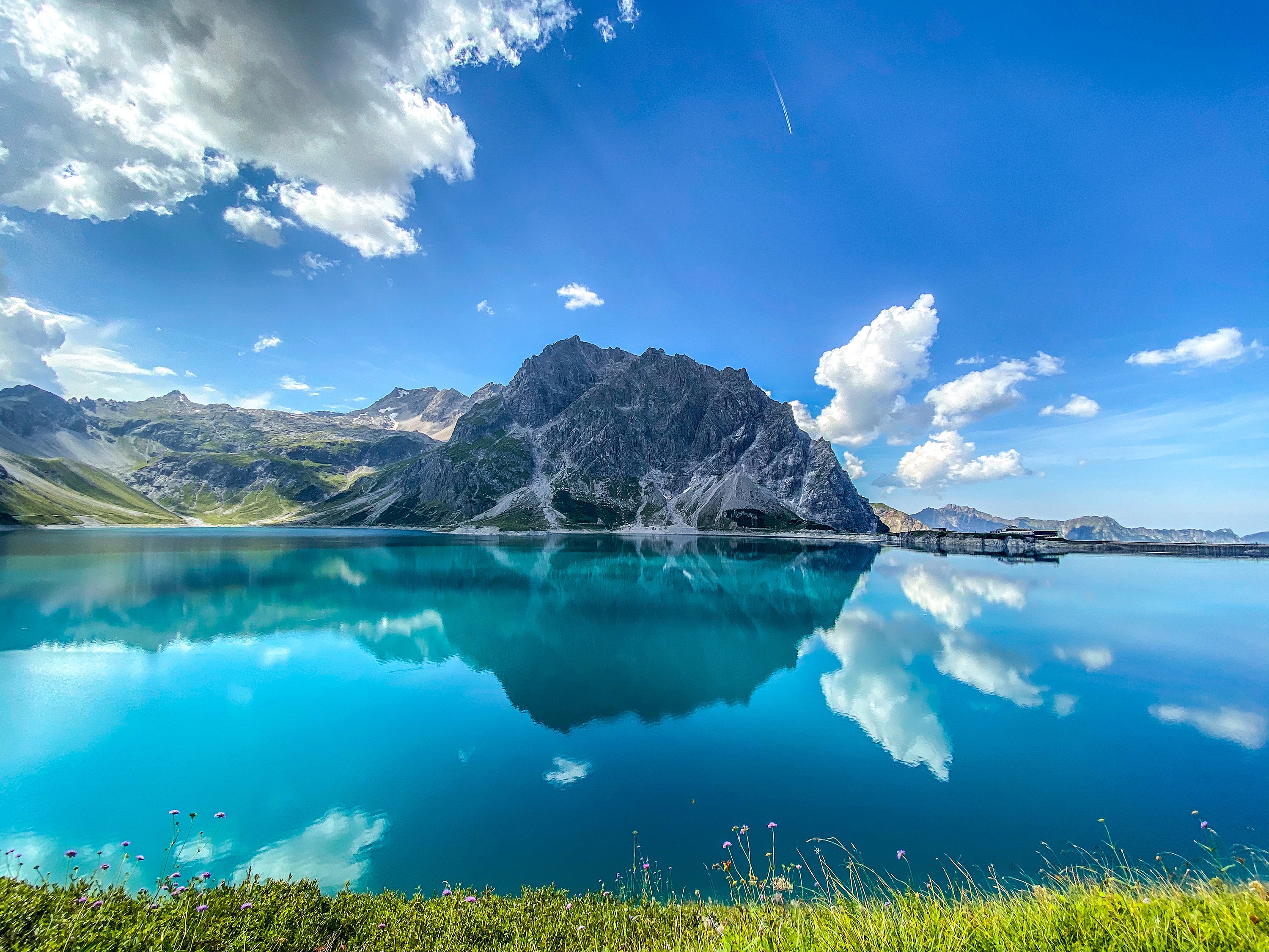 Download mobile wallpaper Lakes, Mountain, Lake, Reflection, Austria, Alps, Earth, Cloud for free.