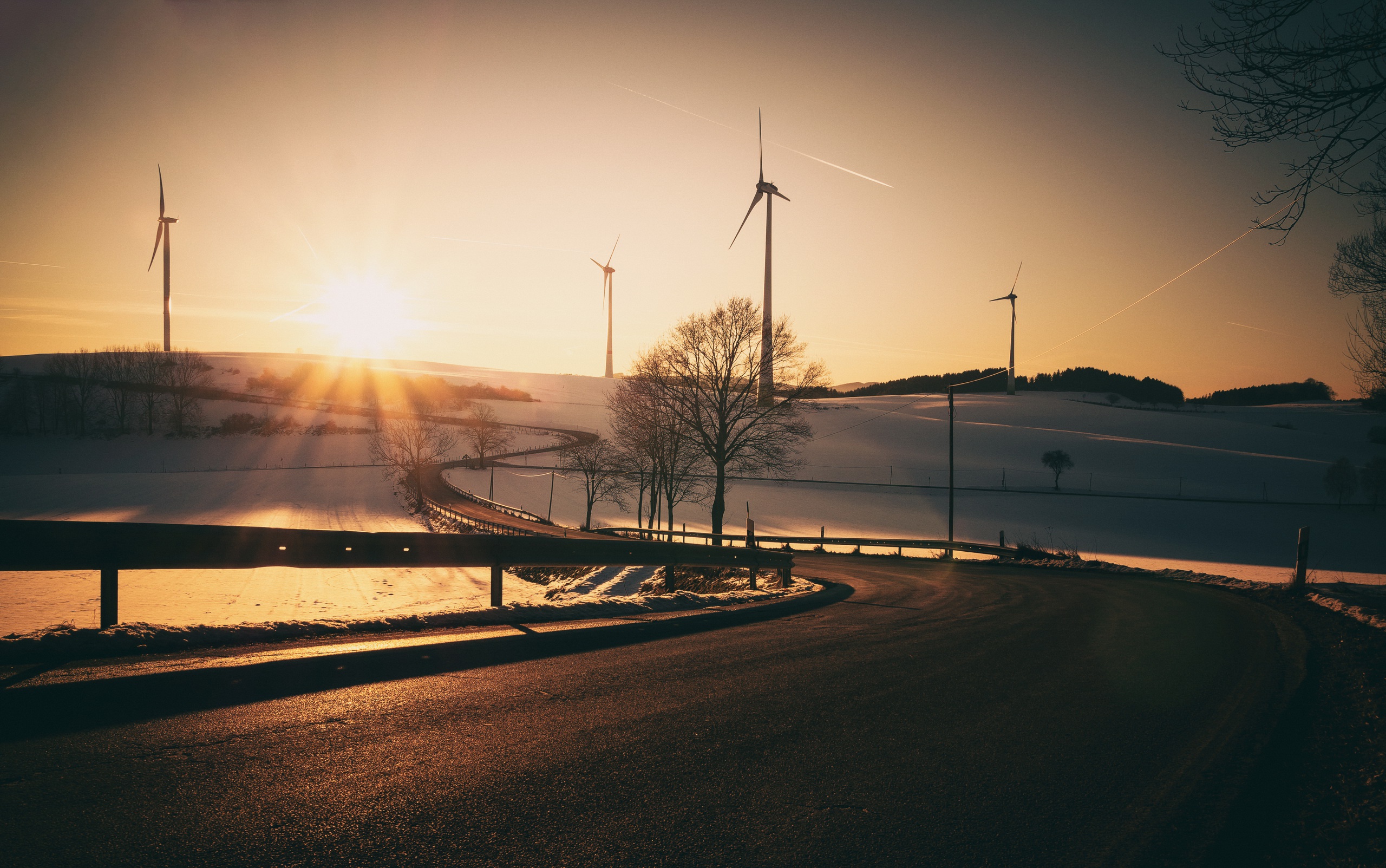 Download mobile wallpaper Winter, Snow, Road, Sunrise, Wind Turbine, Man Made for free.