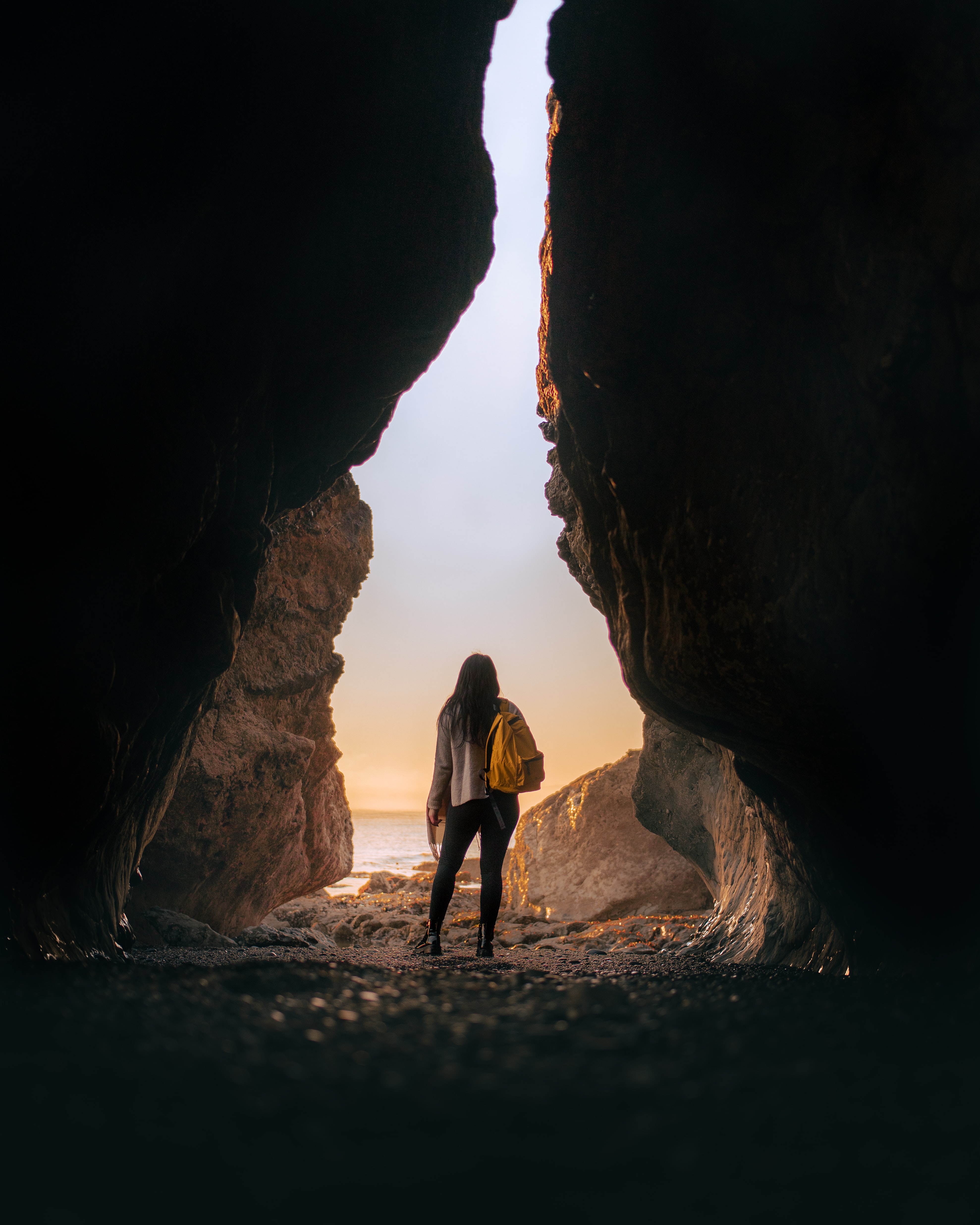 Download mobile wallpaper Miscellanea, Miscellaneous, Sunset, Cave, Loneliness, Girl for free.