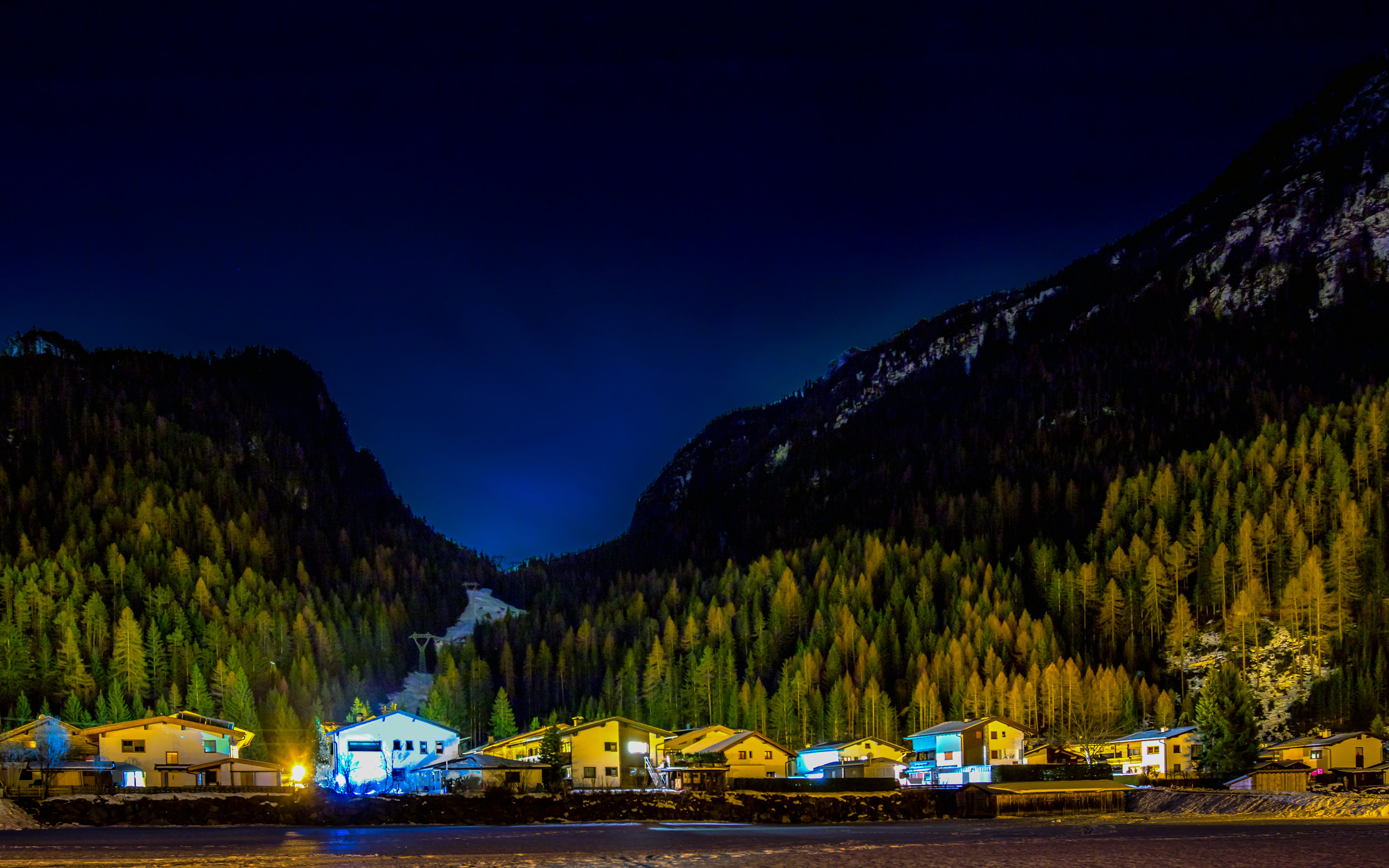 Download mobile wallpaper Night, Mountain, Tree, House, Austria, Village, Man Made for free.
