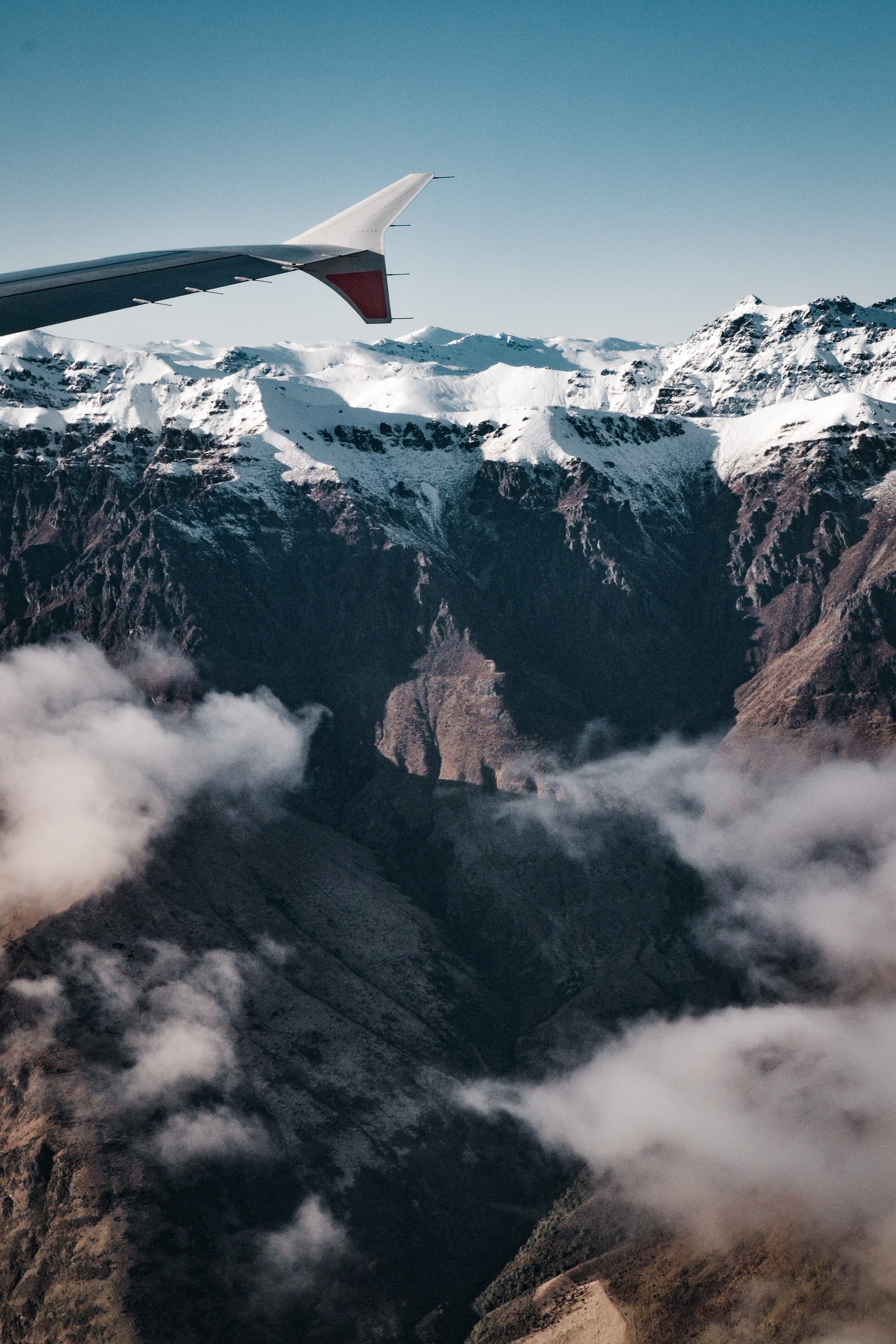 Download mobile wallpaper Nature, Clouds, Rocks, Mountains, Airplane, Plane for free.
