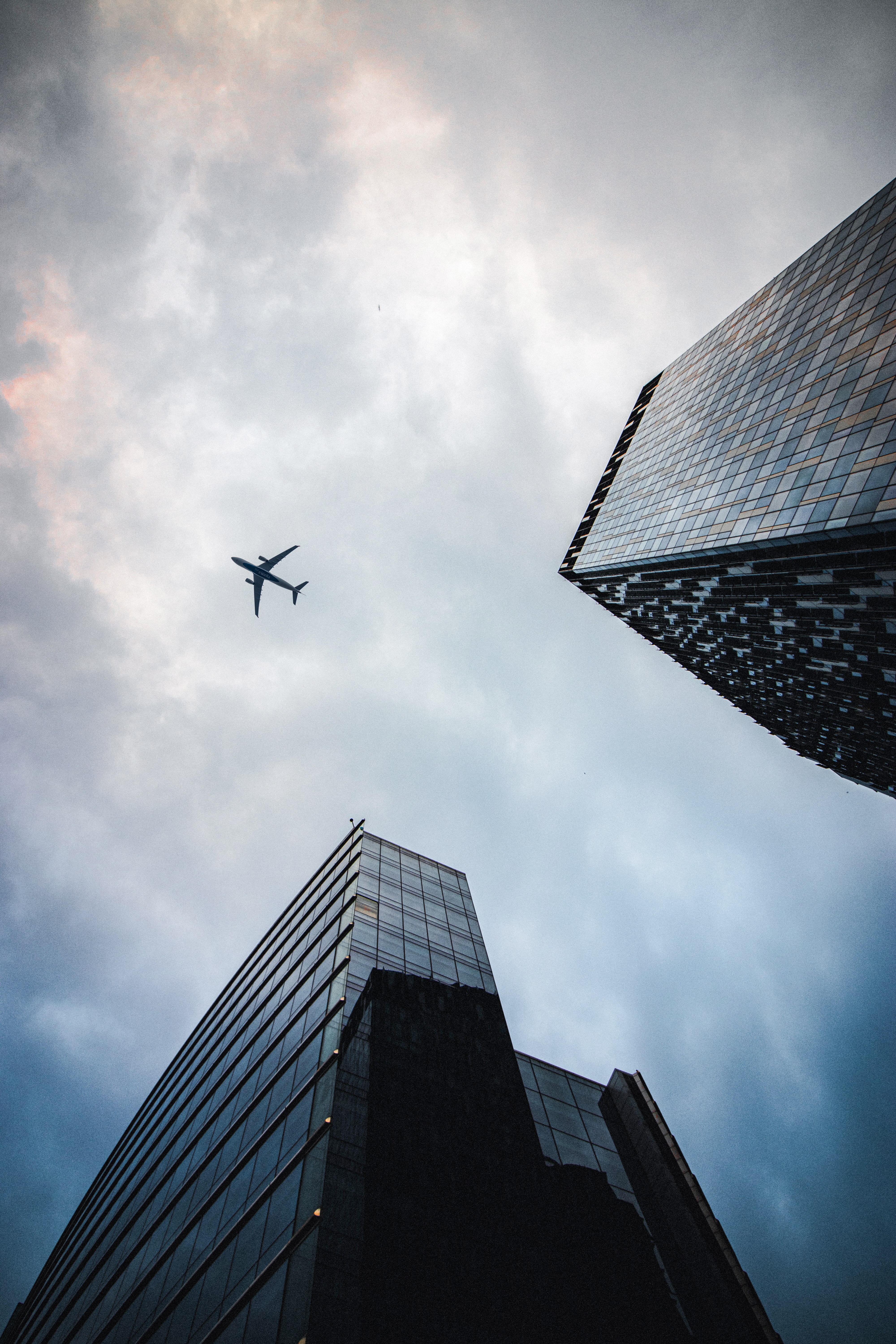 Download mobile wallpaper Flight, Sky, Miscellaneous, Bottom View, Building, Miscellanea, Airplane, Plane for free.