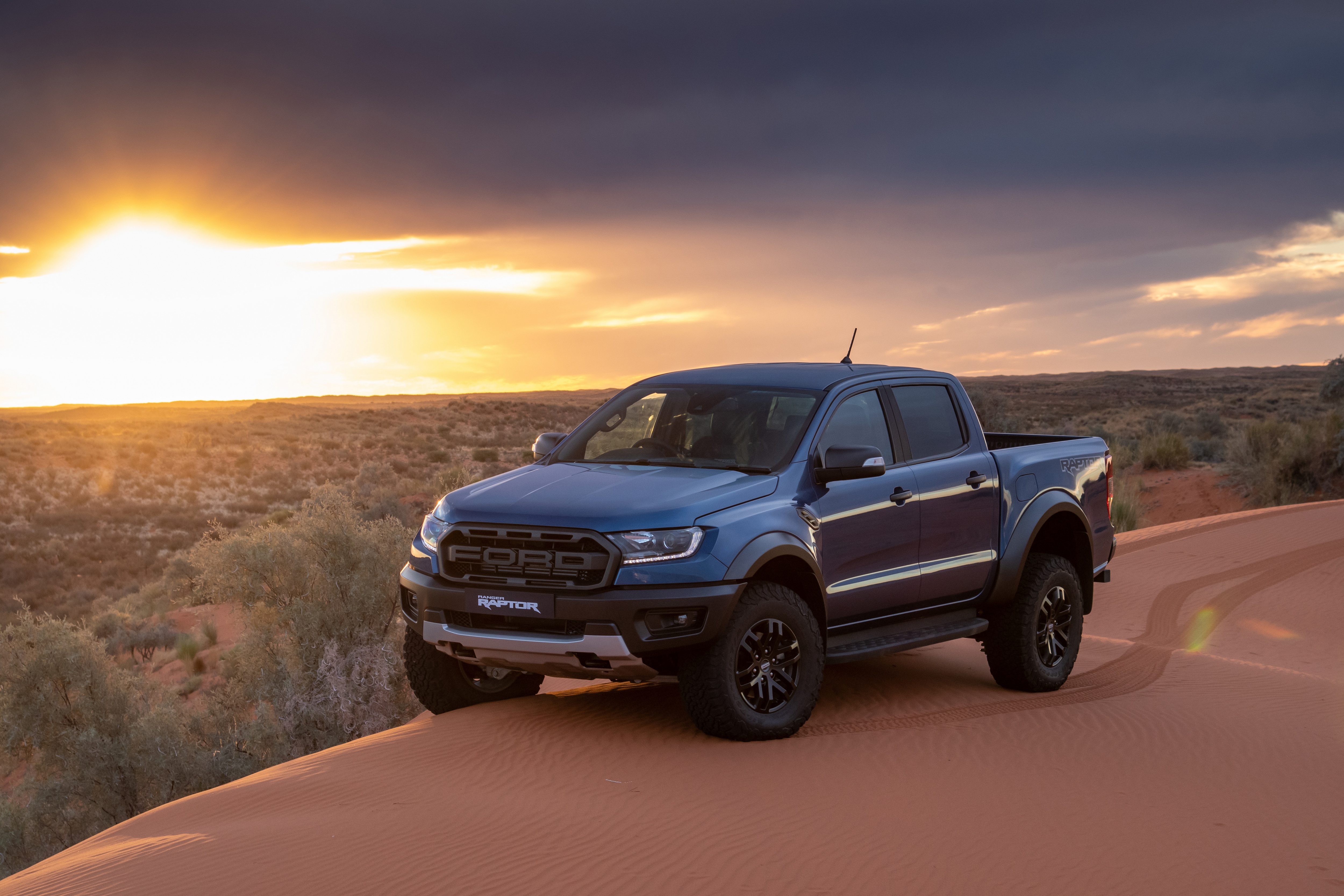 Download mobile wallpaper Sunset, Sand, Ford, Ford Raptor, Vehicles for free.