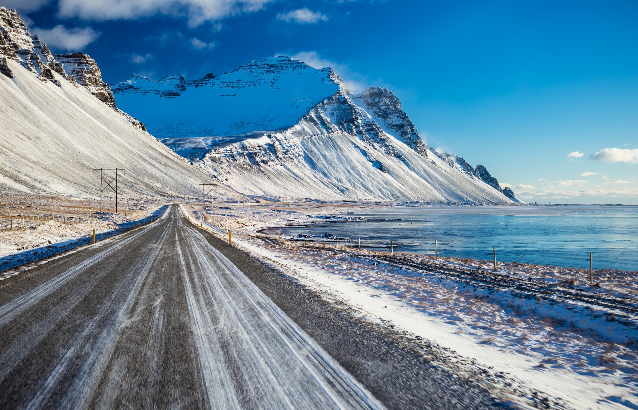 Download mobile wallpaper Landscape, Snow, Mountain, Road, Coastline, Man Made for free.