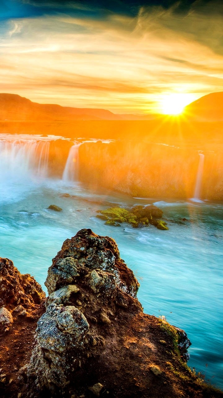 Download mobile wallpaper Sunset, Waterfalls, Waterfall, Earth for free.