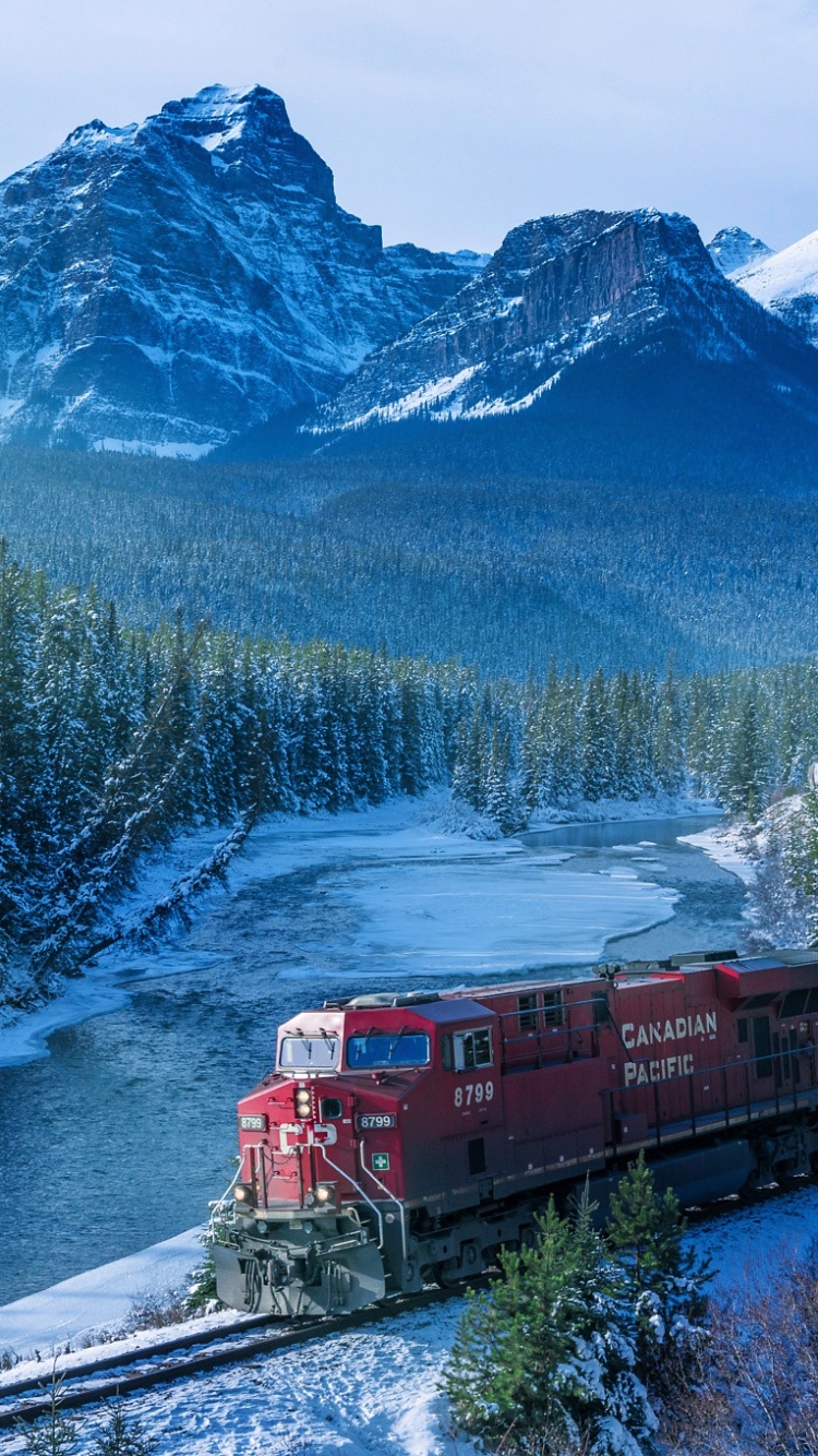 Download mobile wallpaper Landscape, Winter, Snow, Mountain, Forest, River, Train, Vehicle, Vehicles for free.