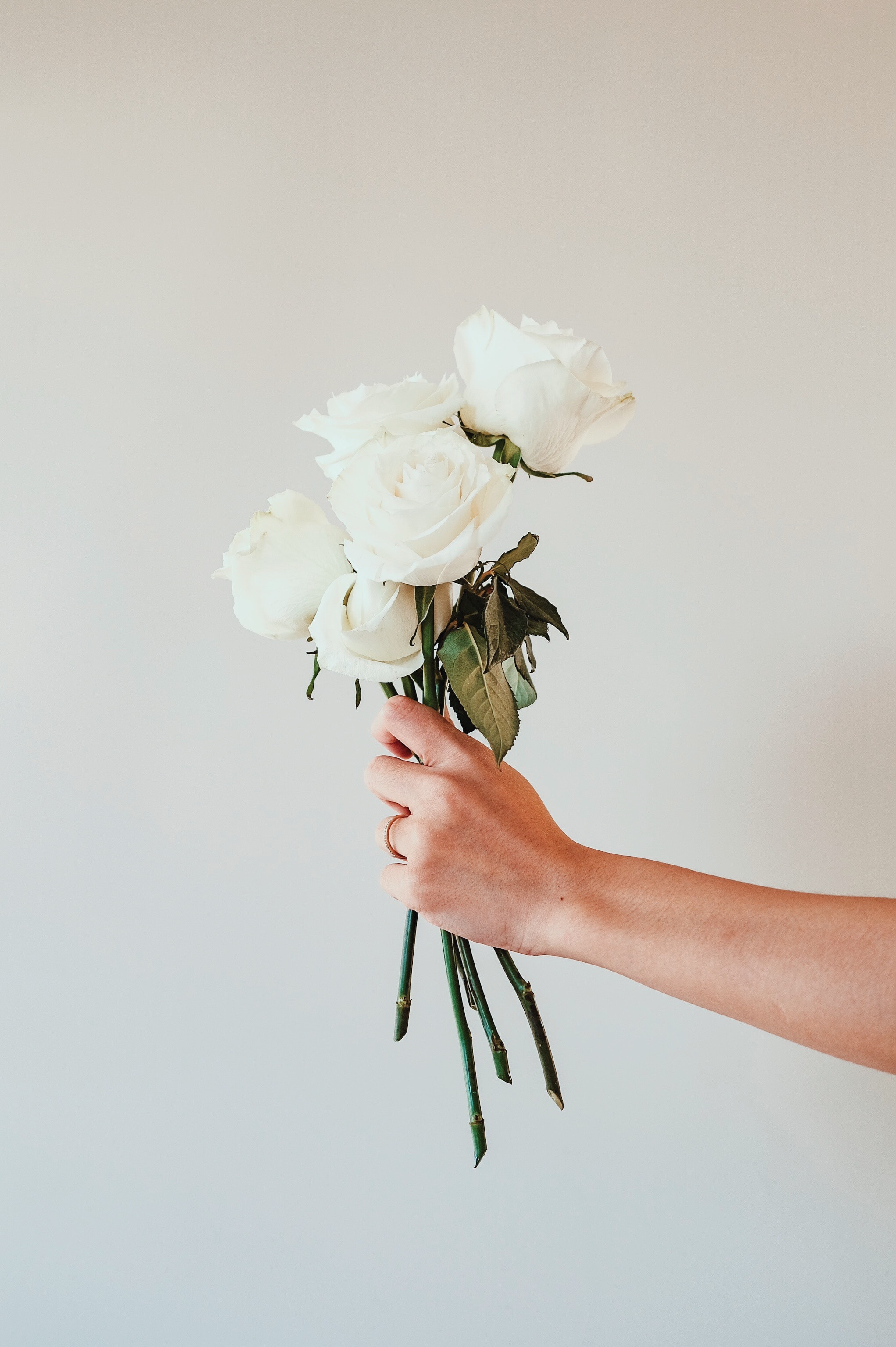 Download mobile wallpaper Bouquet, Hand, Flowers, Roses for free.