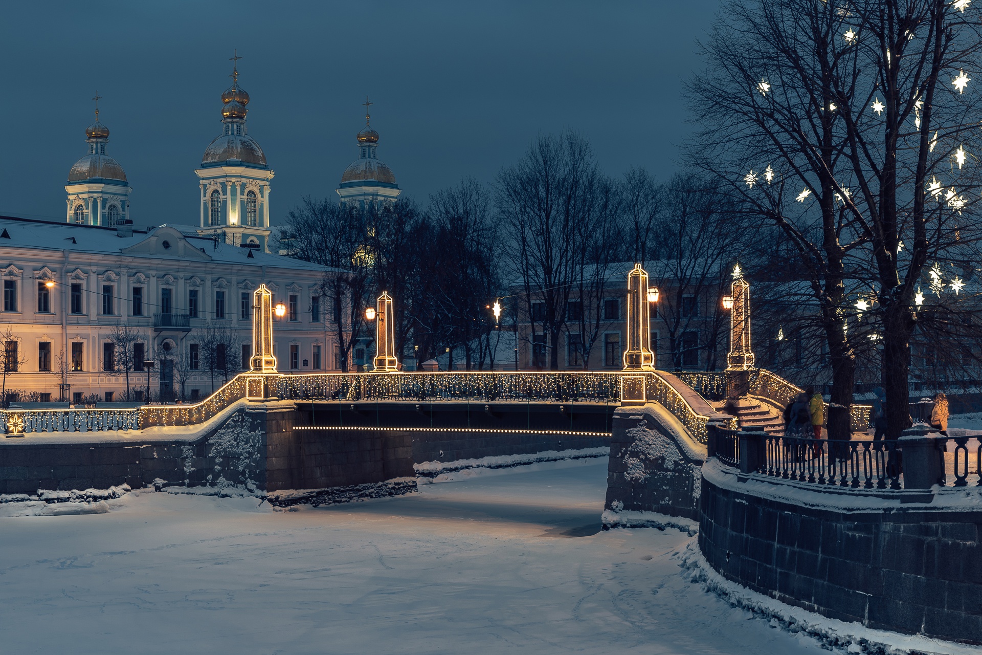 Download mobile wallpaper Cities, Winter, Night, Snow, Bridge, Russia, River, Saint Petersburg, Man Made for free.