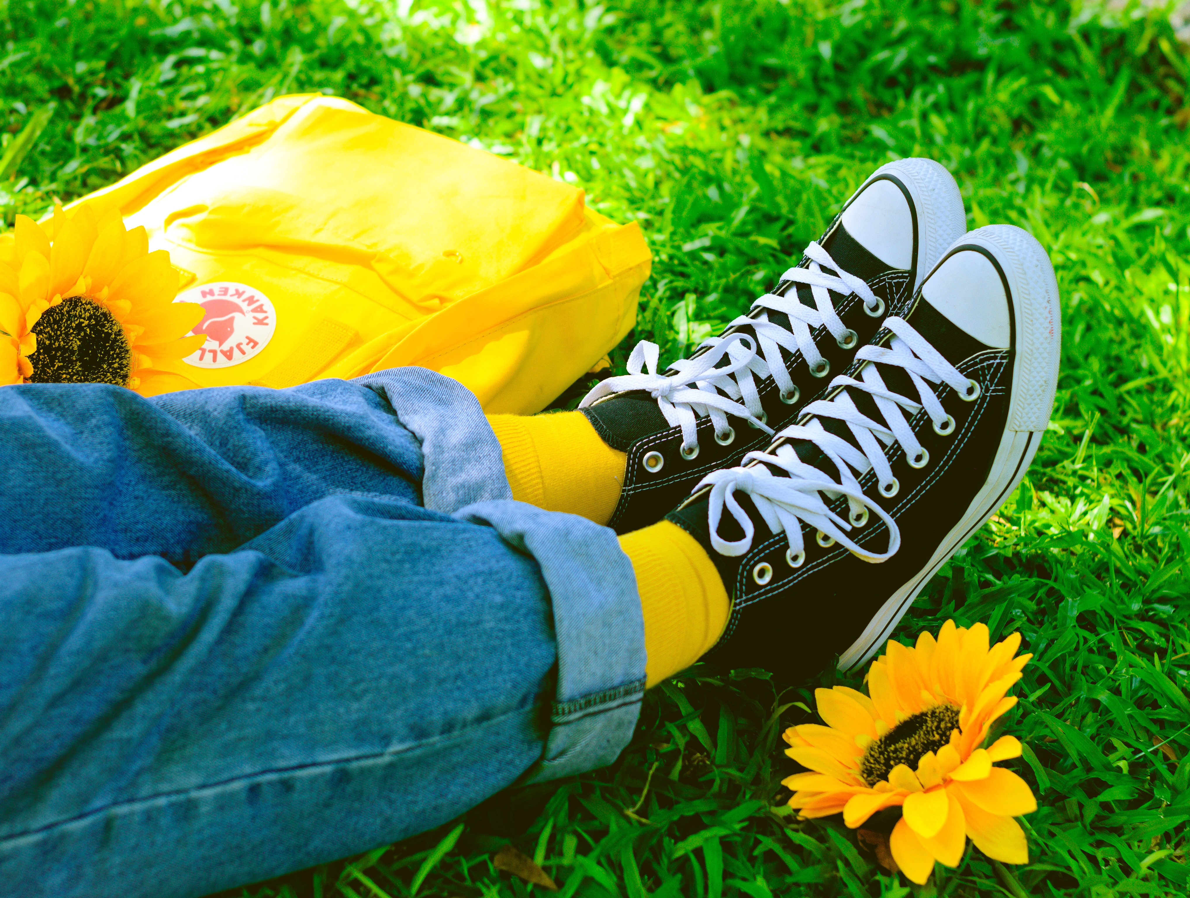 Download mobile wallpaper Grass, Miscellaneous, Miscellanea, Legs, Sneakers, Flower, Summer, Shoes for free.