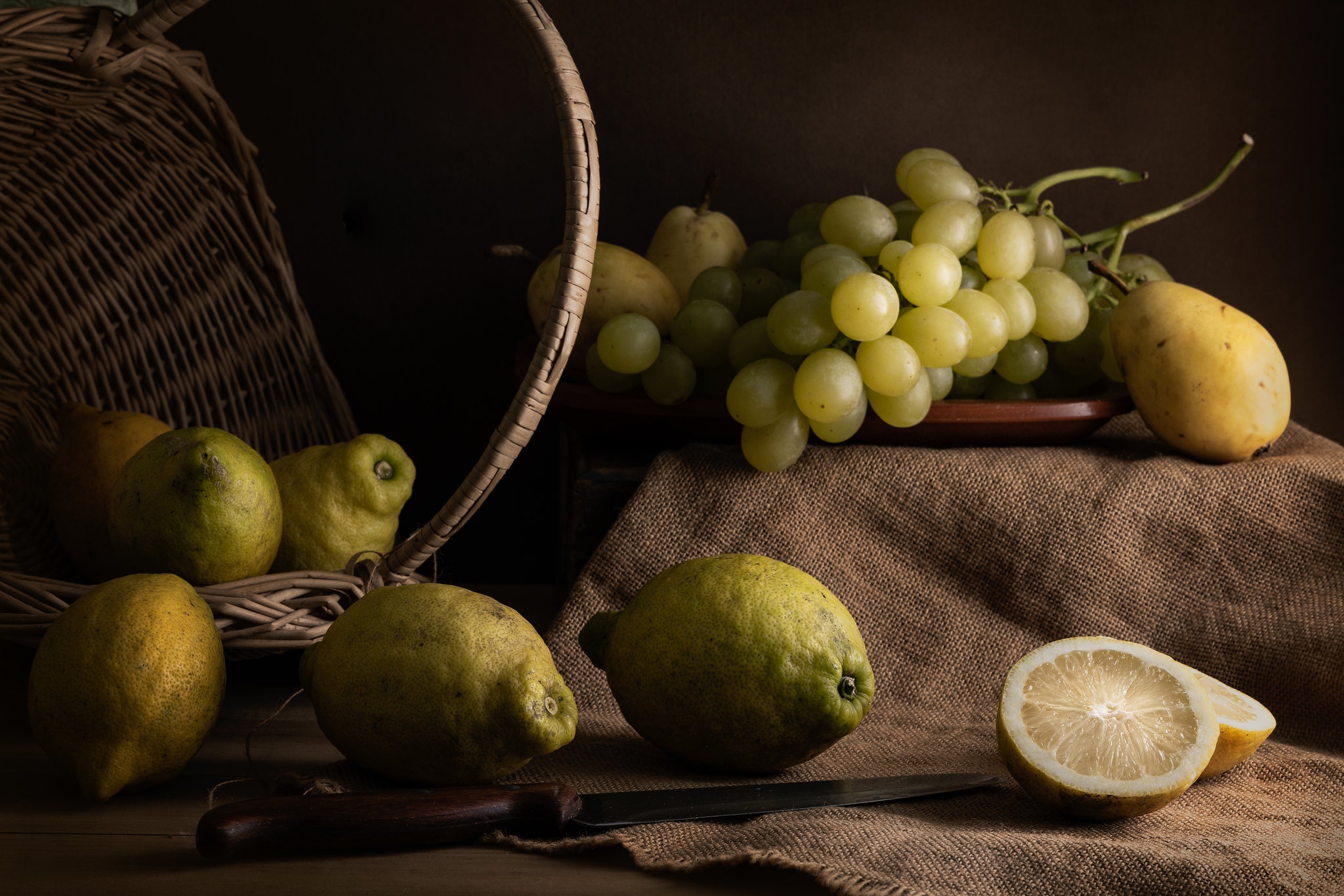 Download mobile wallpaper Food, Grapes, Still Life, Lemon, Fruit, Basket, Pear for free.